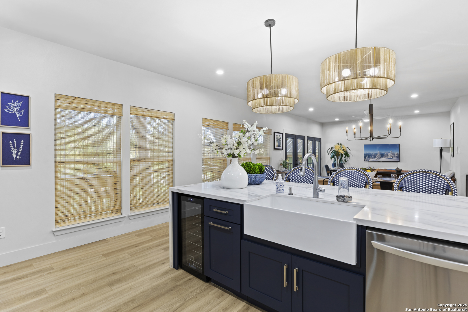 6789 River New Braunfels, TX 78132 - Photo 22 of 50 a view of a kitchen counter space a sink wooden floor and a chandelier