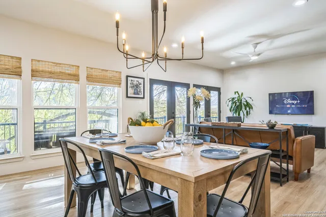 a view of a dining room with furniture window and outside view