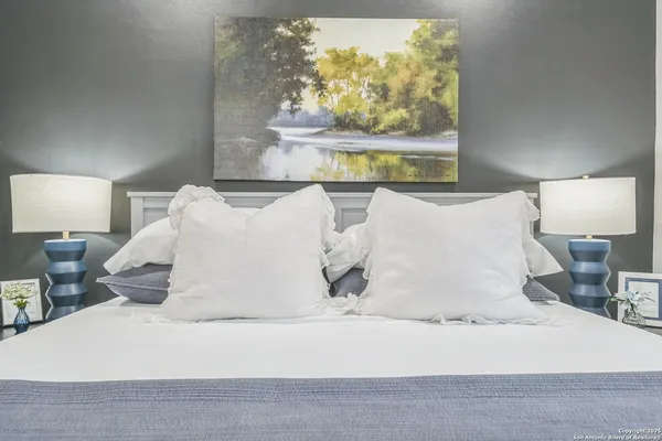 a large white bed in a white room