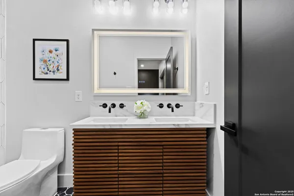 a bathroom with a sink and a mirror