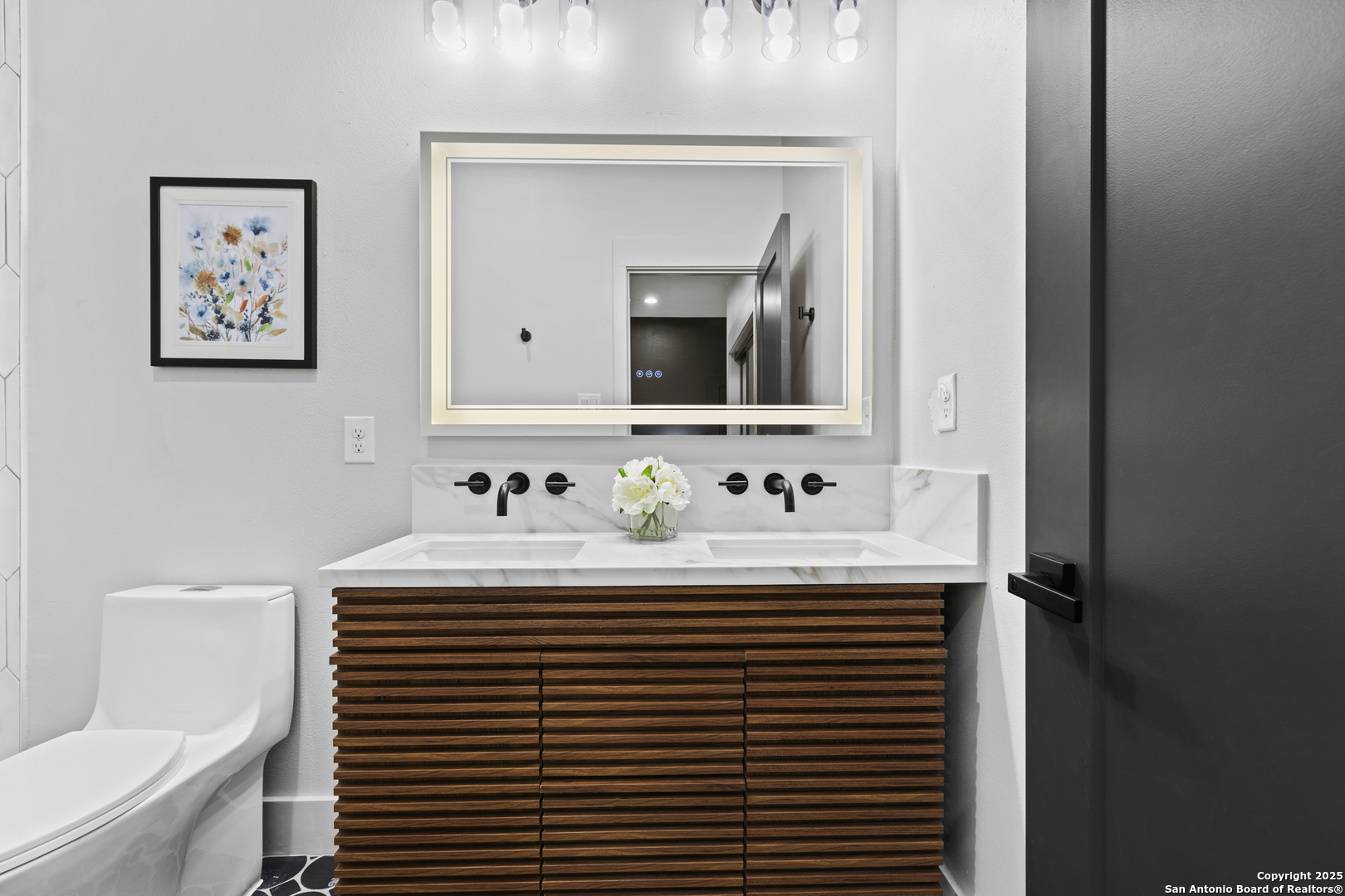 6789 River New Braunfels, TX 78132 - Photo 33 of 50 a bathroom with a sink and a mirror