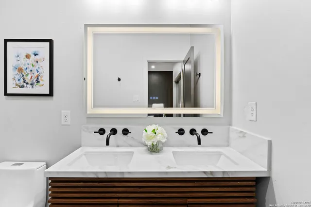 a bathroom with a sink and a mirror