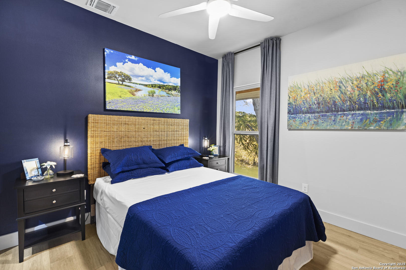 6789 River New Braunfels, TX 78132 - Photo 35 of 50 a bedroom with a large bed and a tv