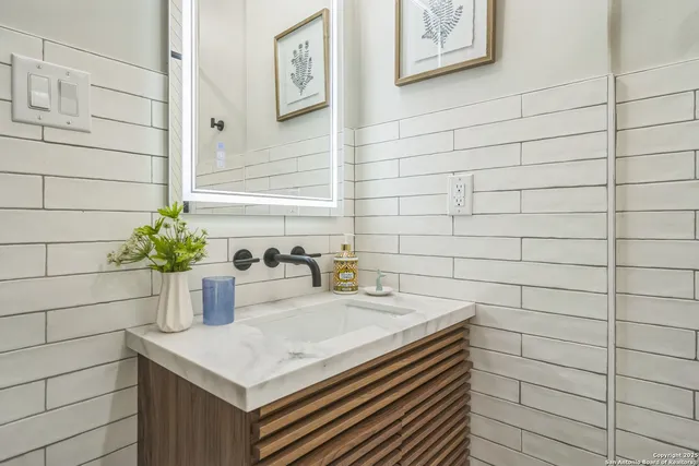 a bathroom with a sink and a shower