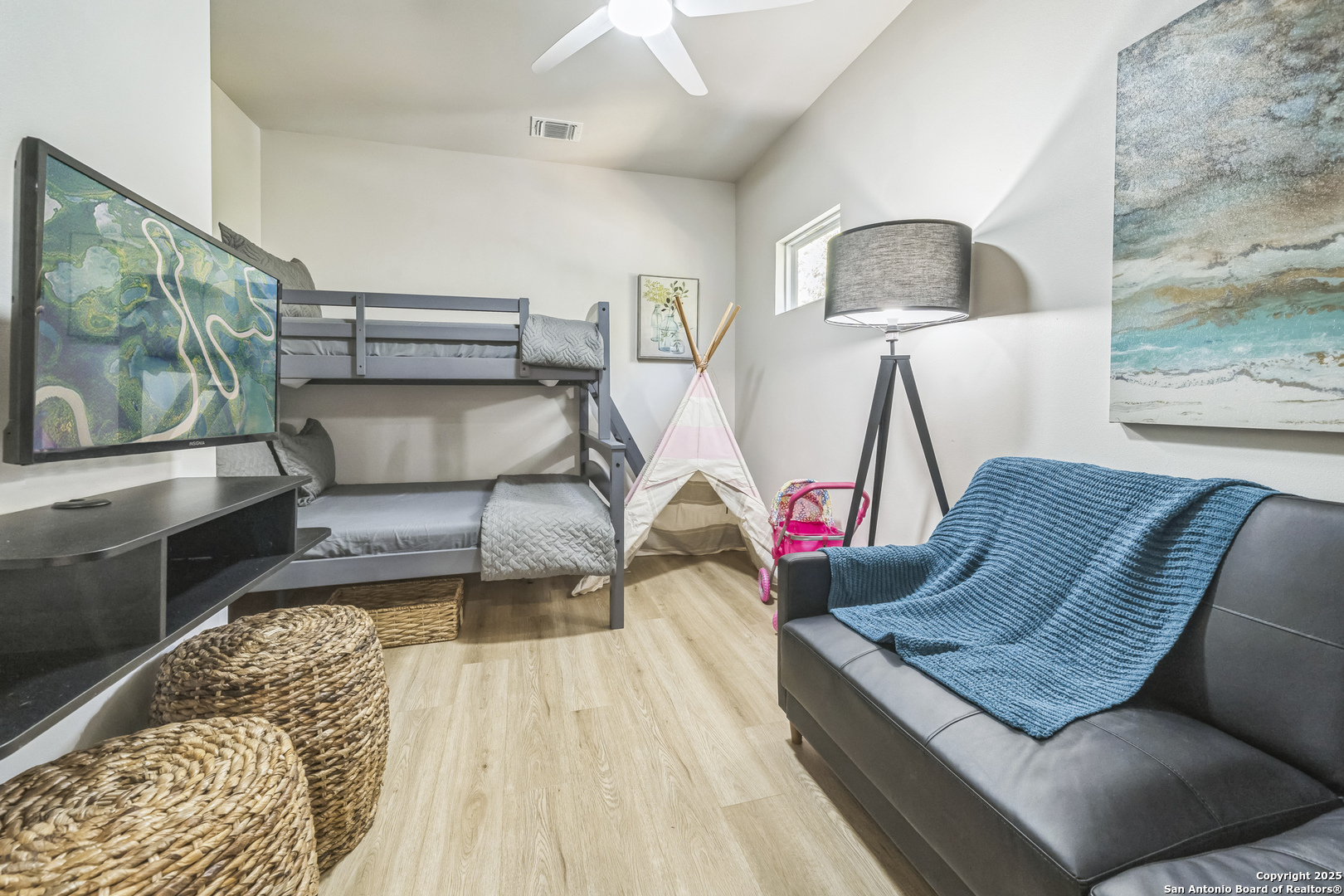 6789 River New Braunfels, TX 78132 - Photo 40 of 50 a living room with furniture and a flat screen tv