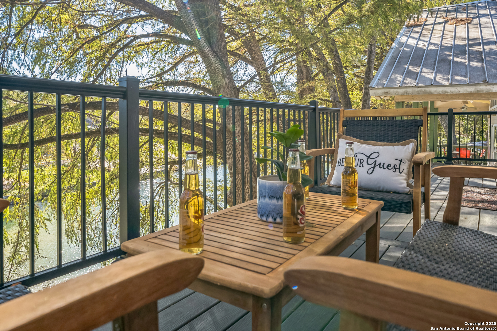 6789 River New Braunfels, TX 78132 - Photo 44 of 50 a view of a patio with couches chairs and wooden floor