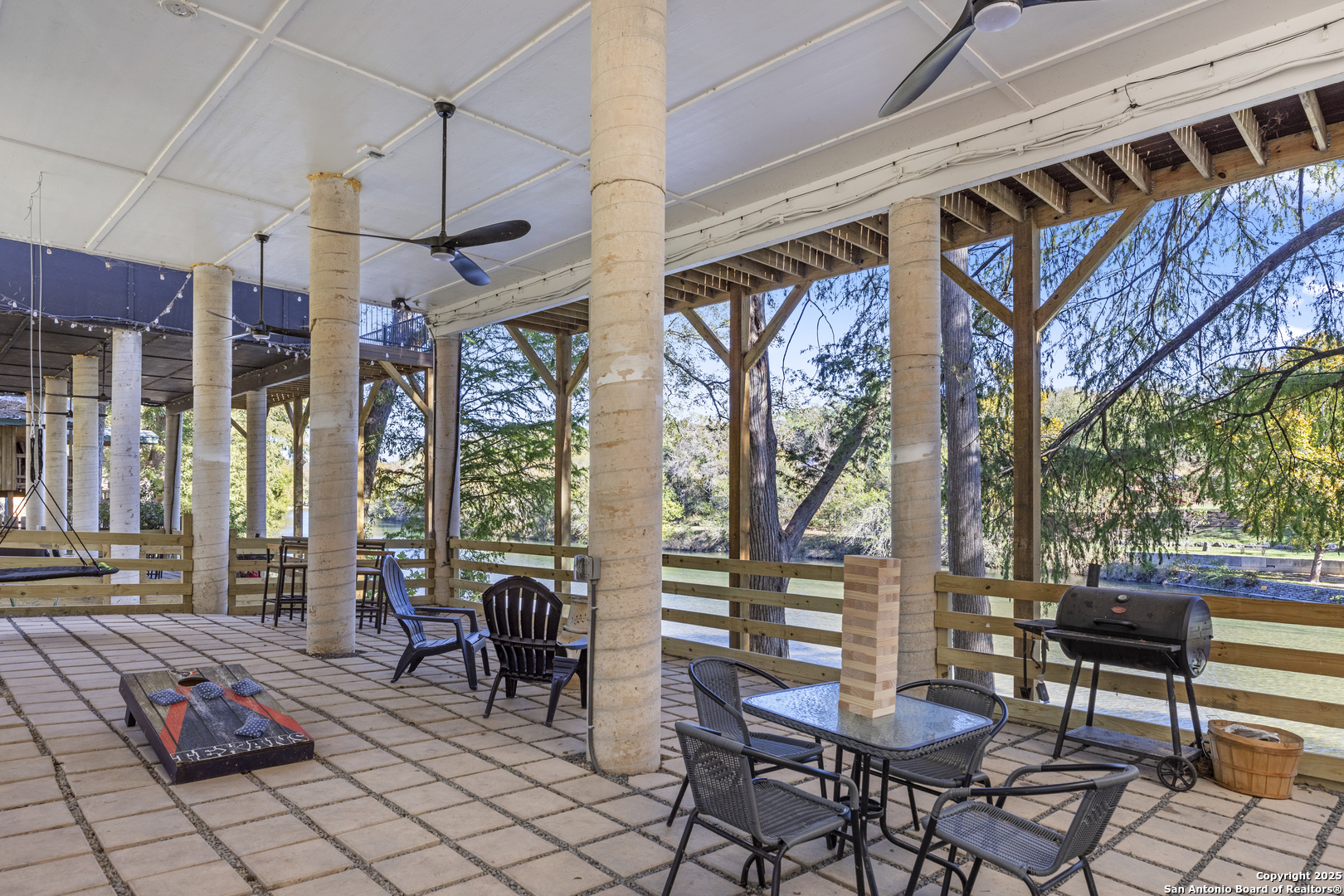6789 River New Braunfels, TX 78132 - Photo 49 of 50 a view of a patio with a table and chairs