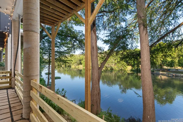 a lake view with large trees