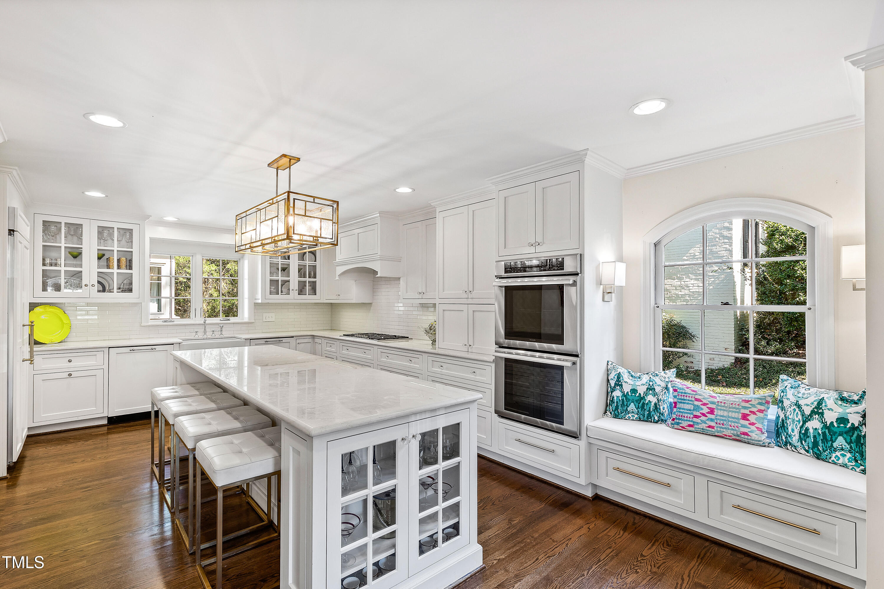 2618 Churchill Road Raleigh, NC 27608 - Photo 13 of 58 a kitchen with a sink stainless steel appliances and windows