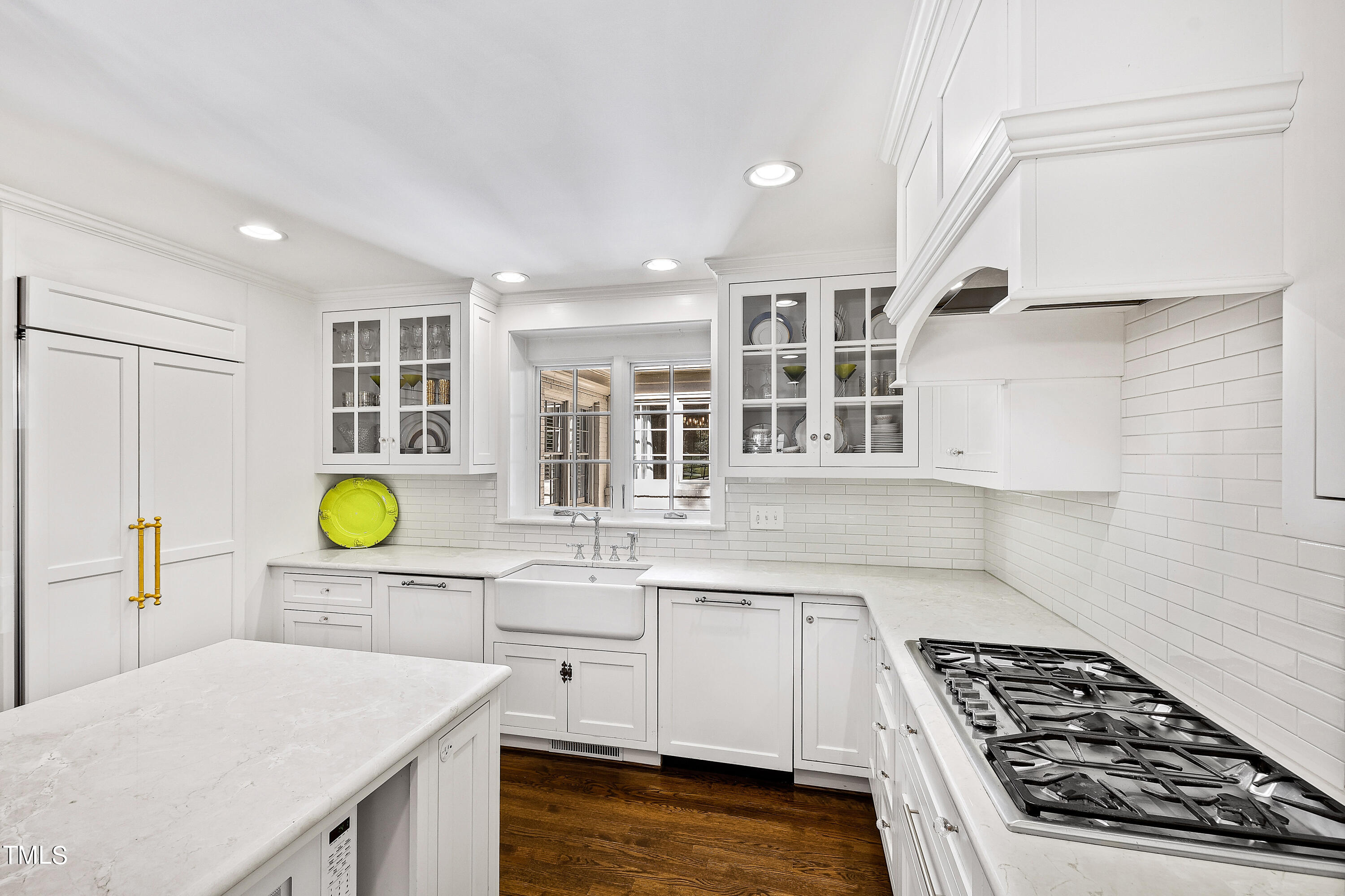 2618 Churchill Road Raleigh, NC 27608 - Photo 17 of 58 a kitchen with cabinets and wooden floor