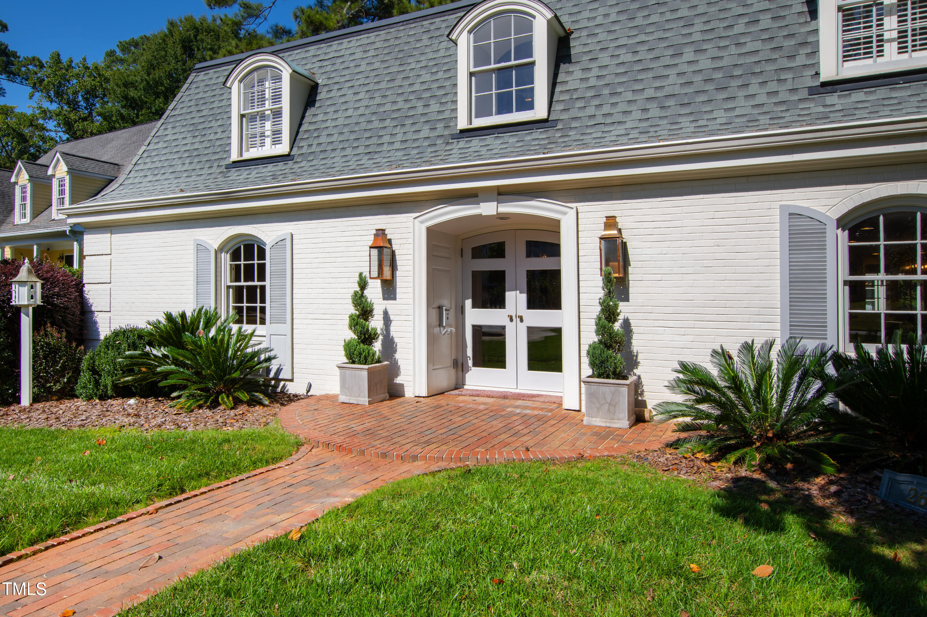 2618 Churchill Road Raleigh, NC 27608 - Photo 2 of 58 a front view of a house with a yard
