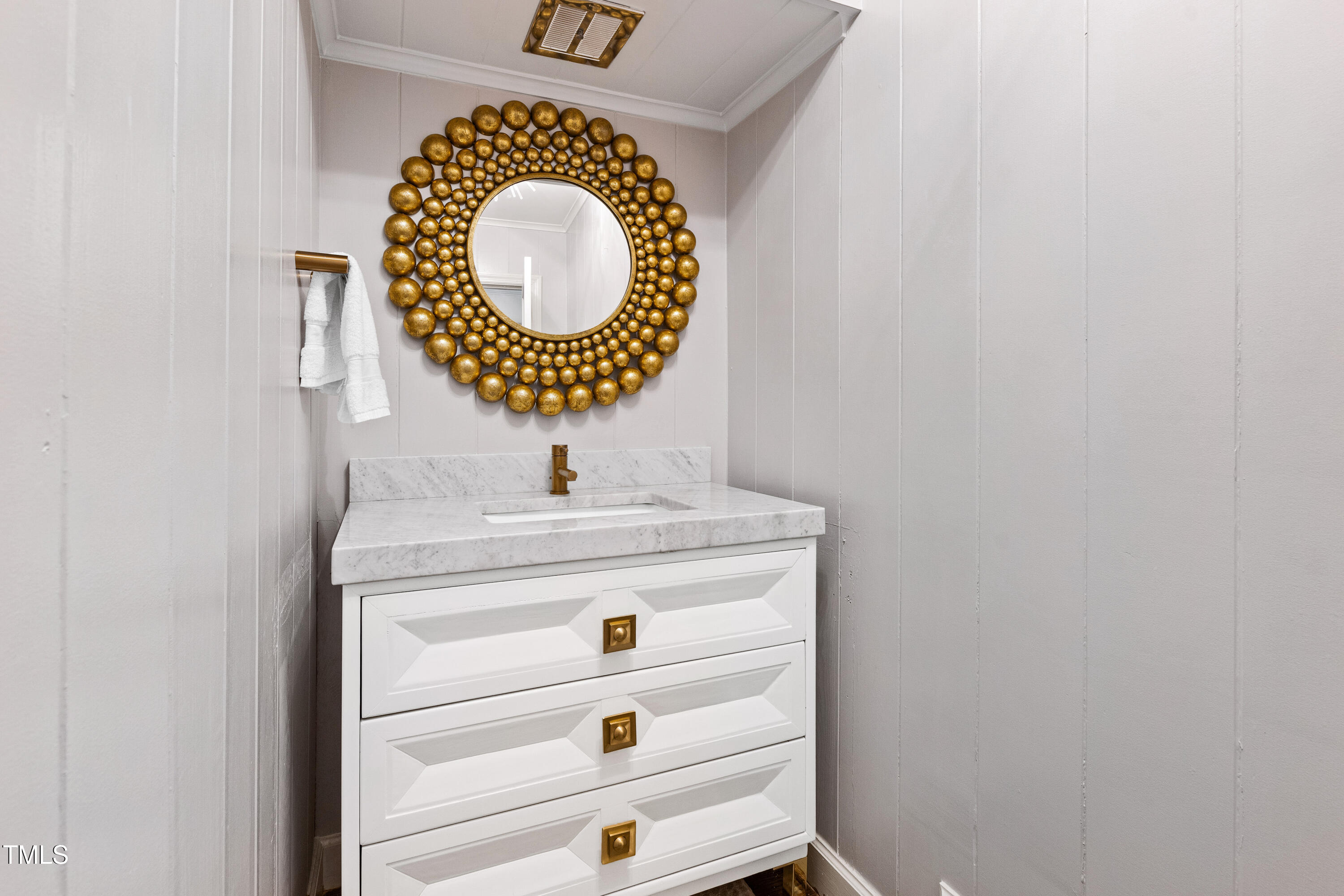 2618 Churchill Road Raleigh, NC 27608 - Photo 21 of 58 a bathroom with a sink and a mirror
