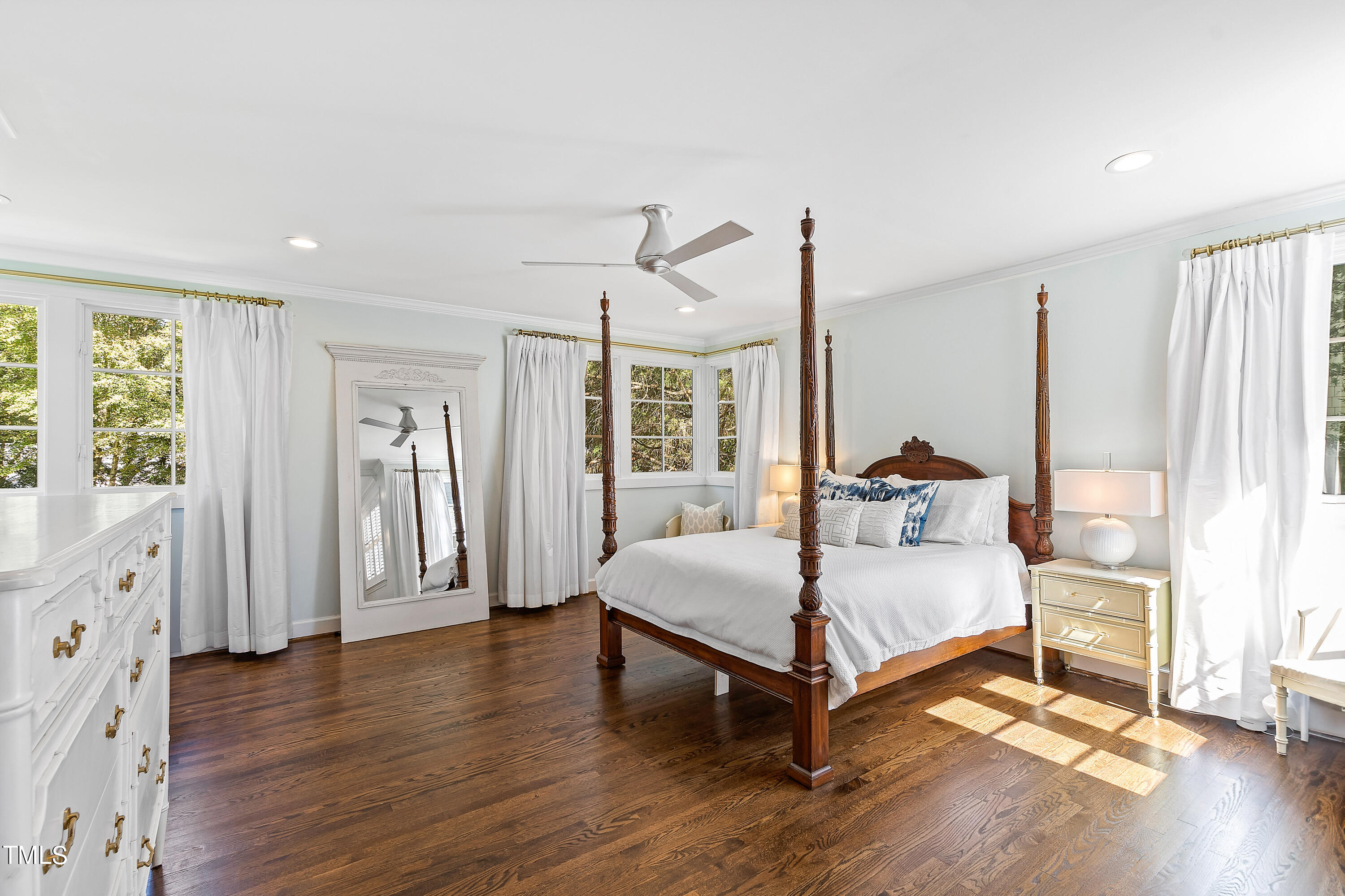 2618 Churchill Road Raleigh, NC 27608 - Photo 23 of 58 a bedroom with a bed lamp closet and large window