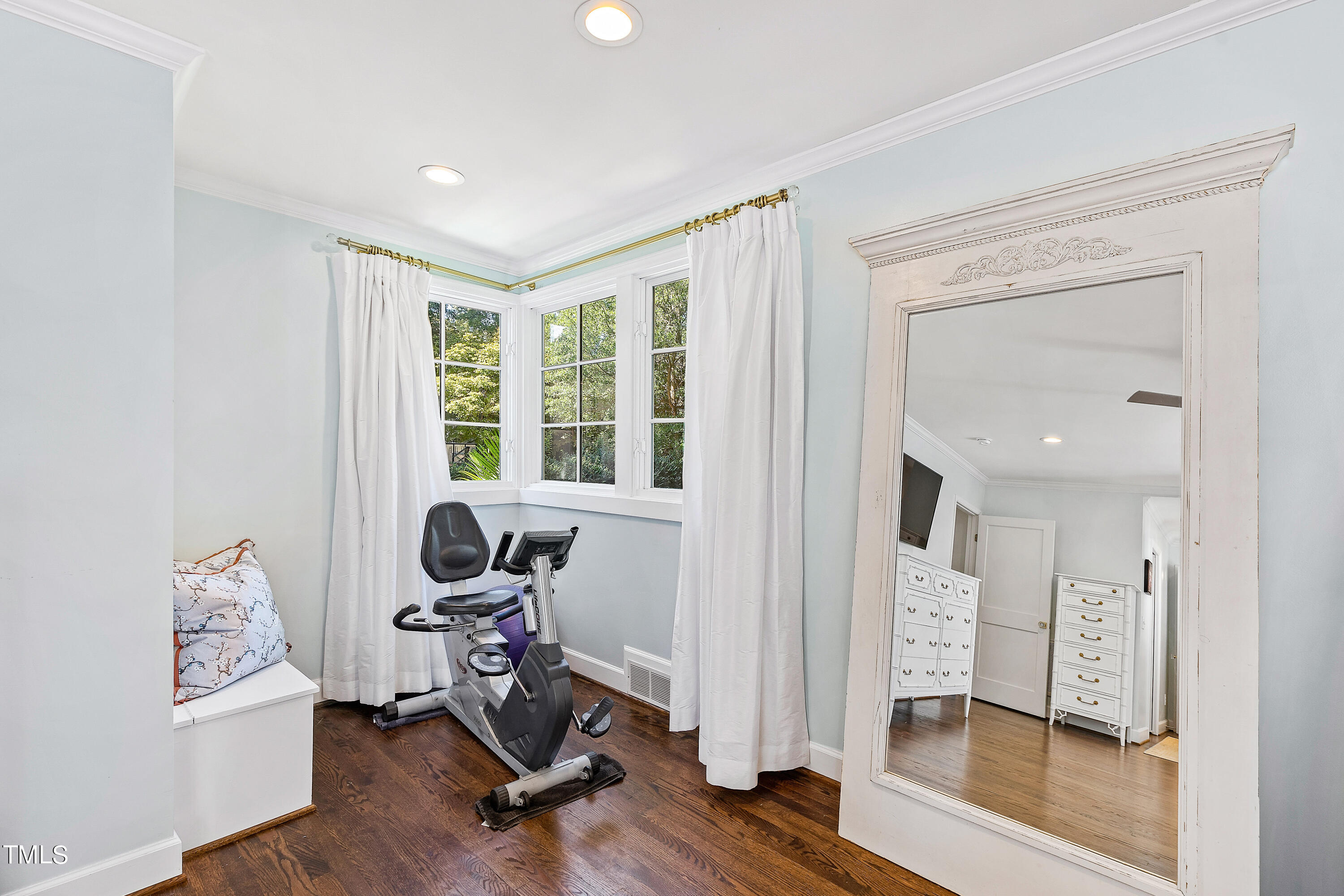 2618 Churchill Road Raleigh, NC 27608 - Photo 25 of 58 a view of a workspace with wooden floor and windows
