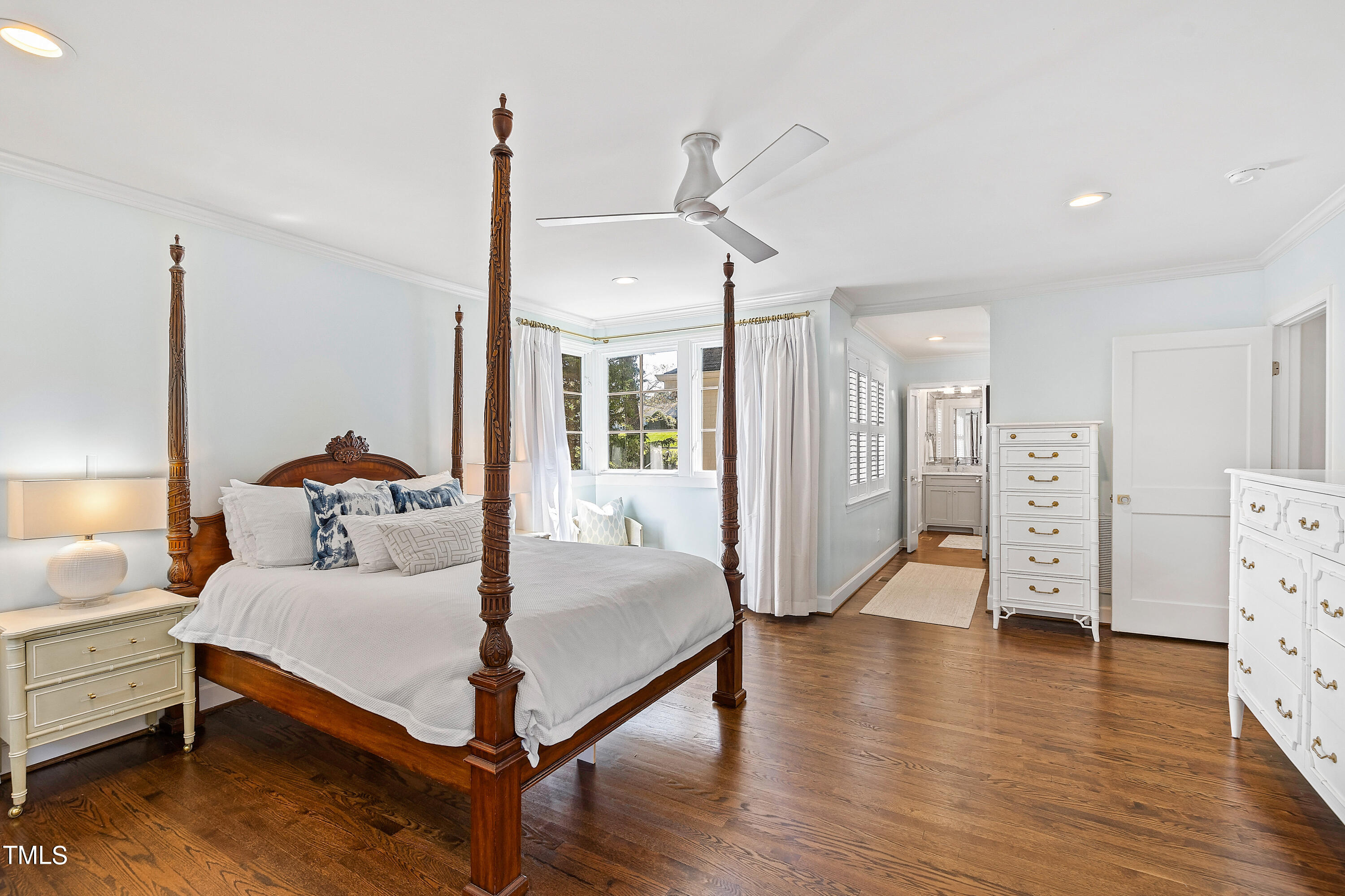 2618 Churchill Road Raleigh, NC 27608 - Photo 26 of 58 a bedroom with furniture and a chandelier