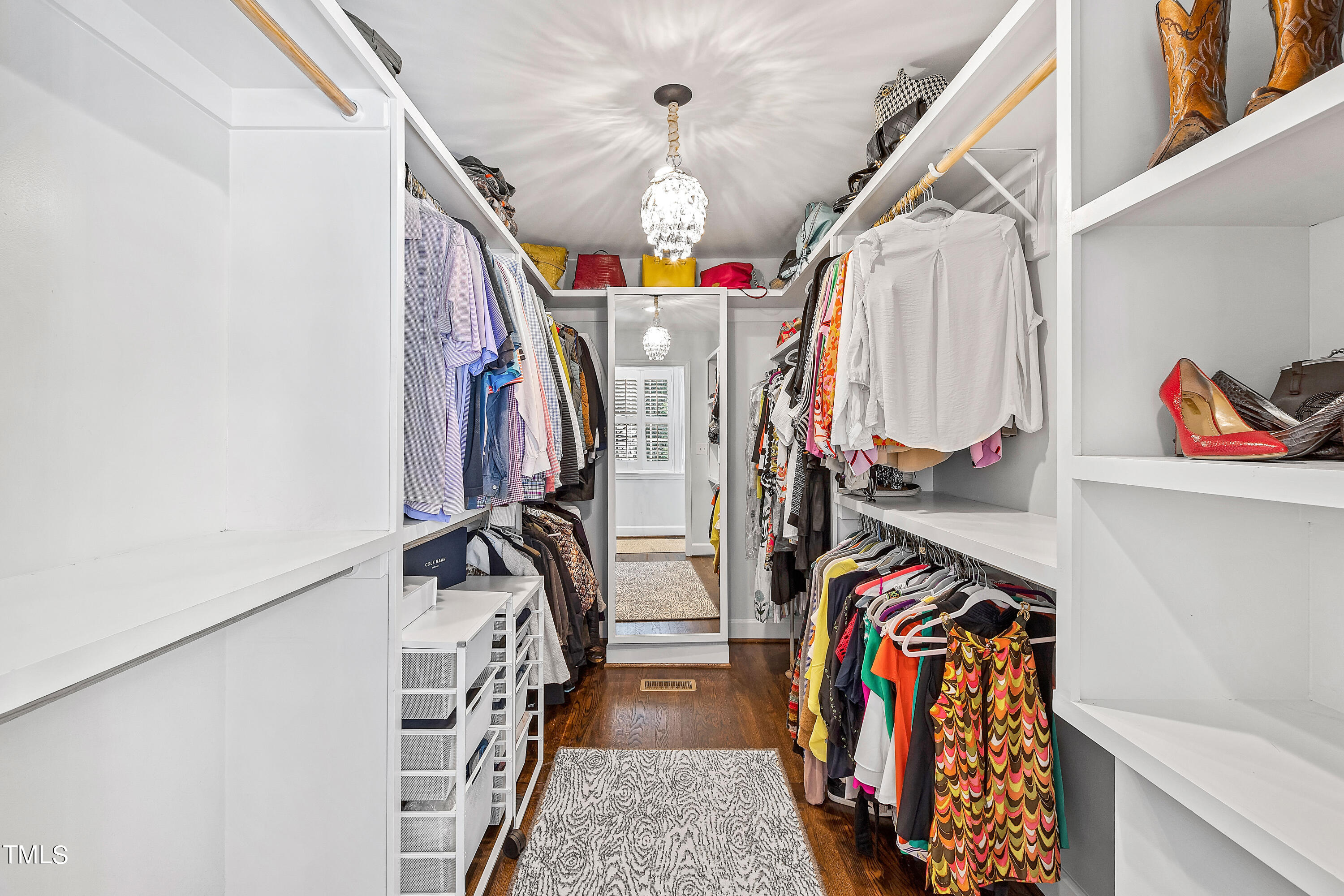 2618 Churchill Road Raleigh, NC 27608 - Photo 29 of 58 a view of walk in closet with clothes and shoes