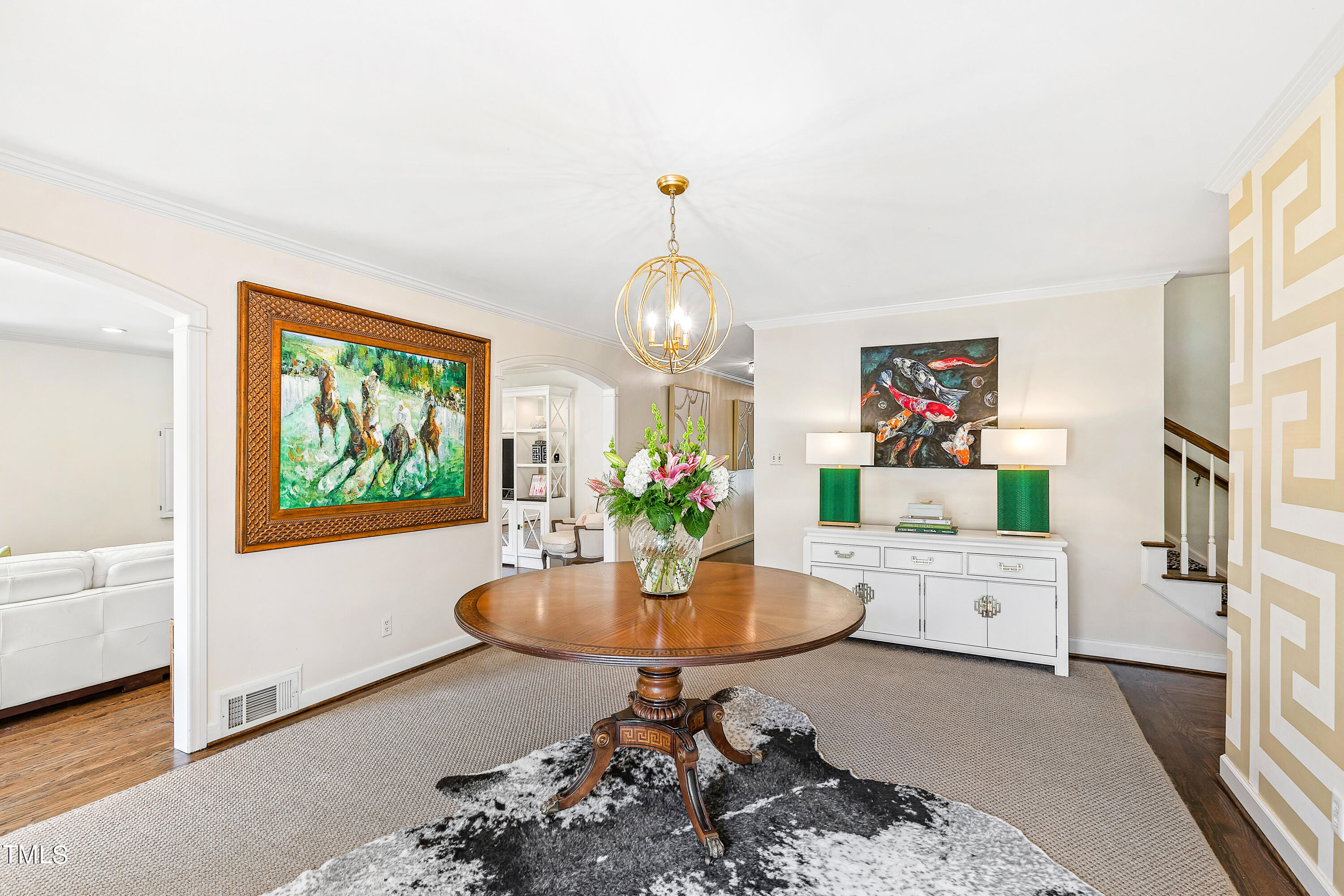 2618 Churchill Road Raleigh, NC 27608 - Photo 4 of 58 a living room with furniture and a chandelier