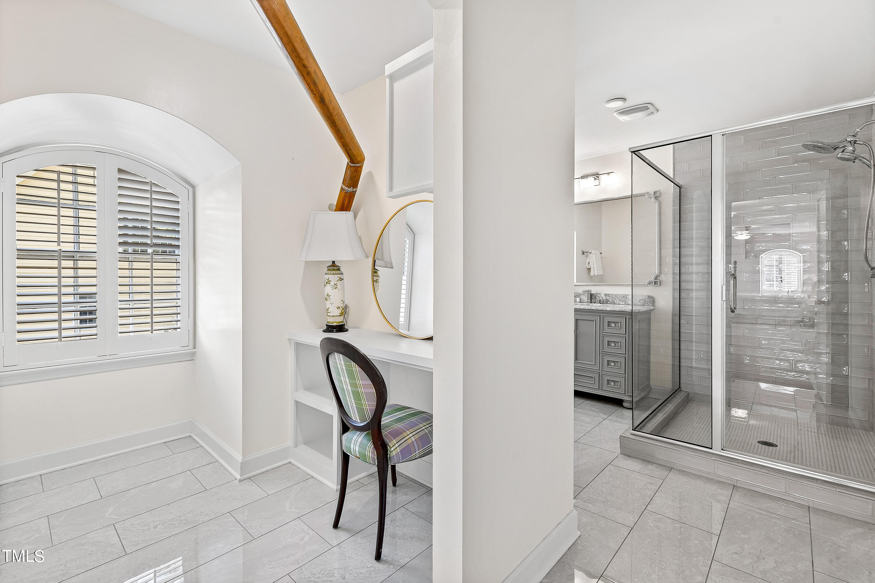 2618 Churchill Road Raleigh, NC 27608 - Photo 43 of 58 a spacious bathroom with a shower a mirror and a shower