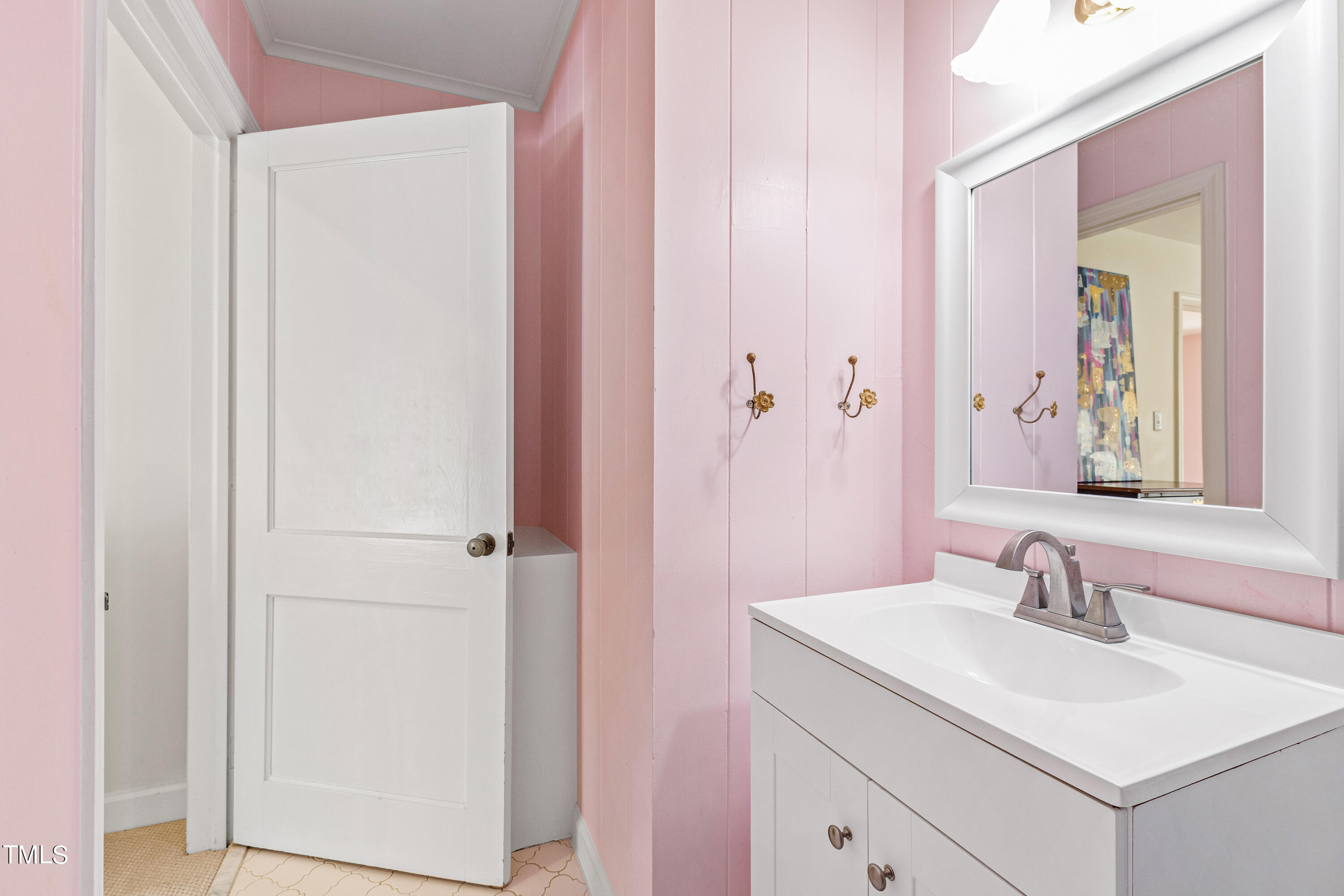 2618 Churchill Road Raleigh, NC 27608 - Photo 44 of 58 a bathroom with a sink and a mirror