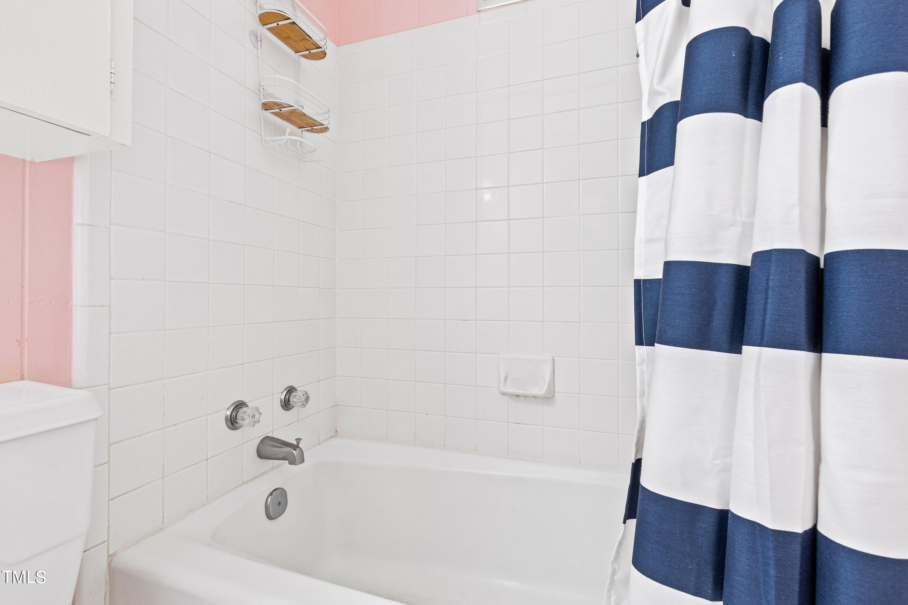 2618 Churchill Road Raleigh, NC 27608 - Photo 45 of 58 a bathroom with a bathtub and a shower