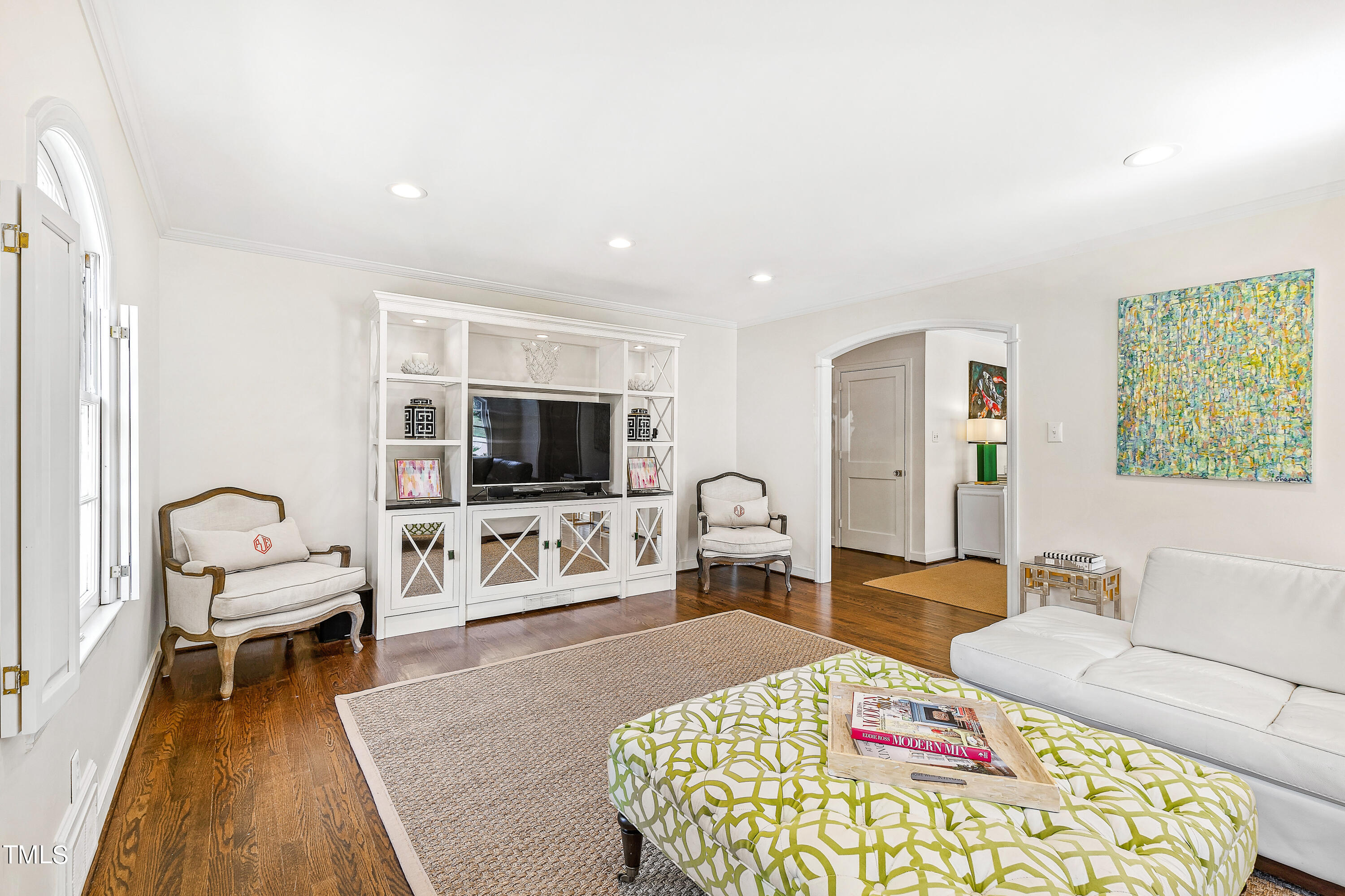 2618 Churchill Road Raleigh, NC 27608 - Photo 7 of 58 a living room with furniture and a flat screen tv