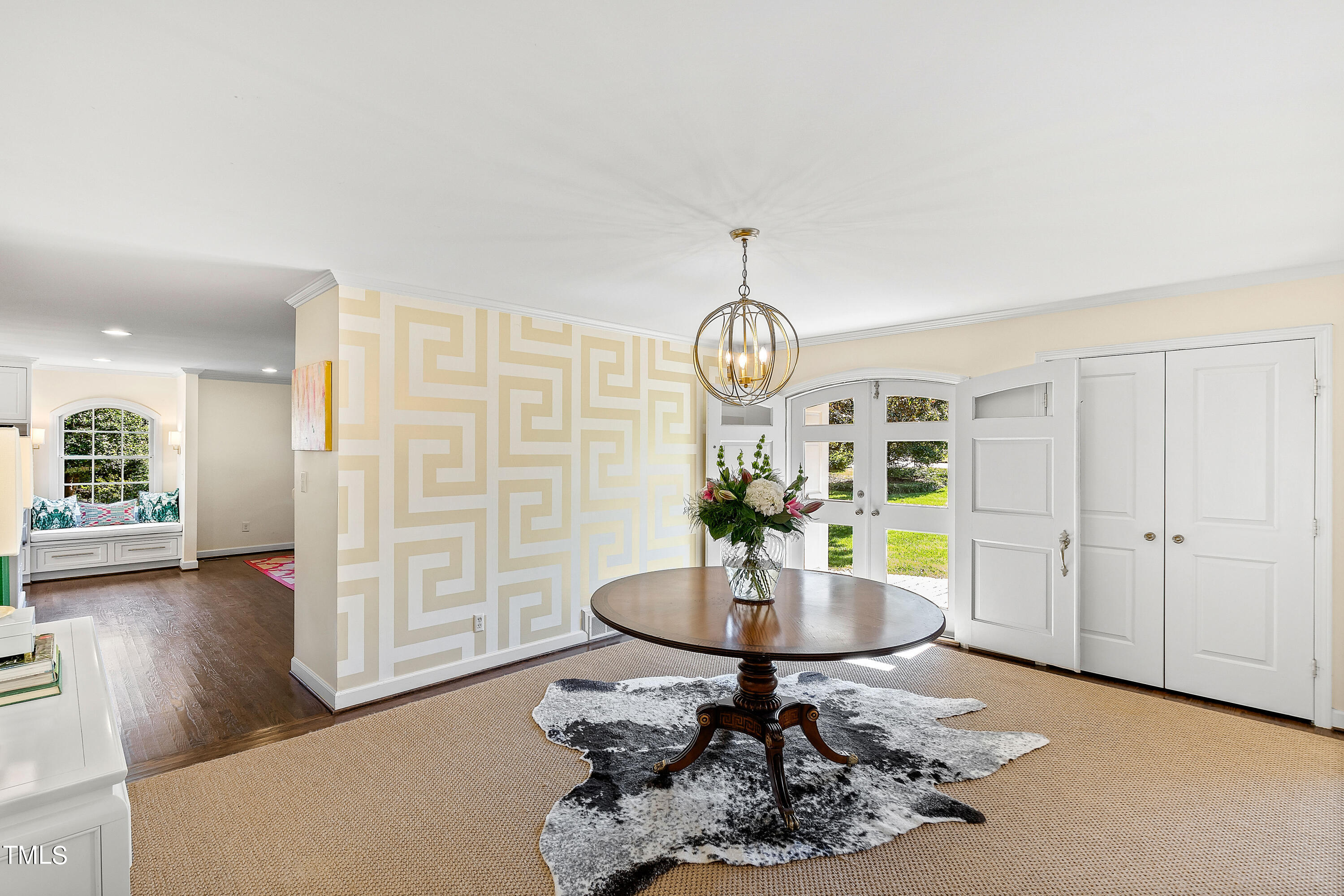 2618 Churchill Road Raleigh, NC 27608 - Photo 8 of 58 a living room with furniture a window and dining table