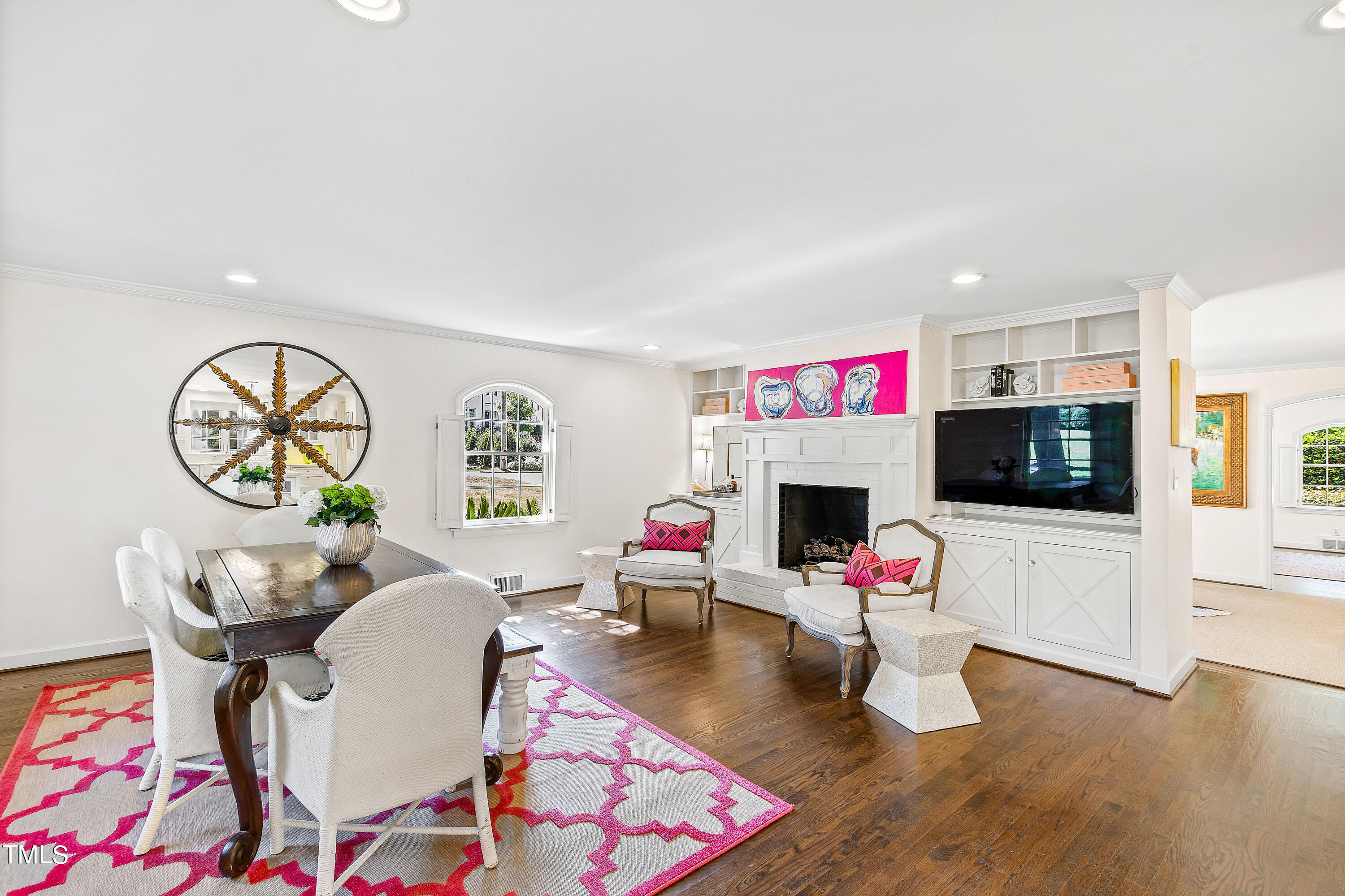 2618 Churchill Road Raleigh, NC 27608 - Photo 9 of 58 a living room with furniture and a flat screen tv