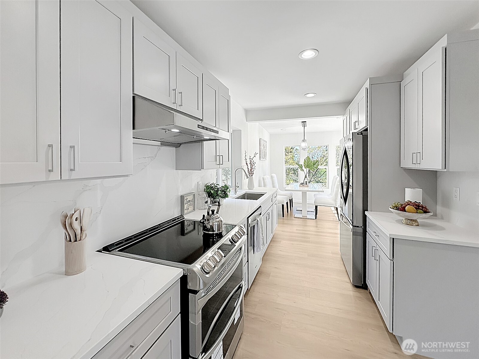 7403 Beverly Boulevard Everett, WA 98203 - Photo 5 of 19 a kitchen with kitchen island a sink a stove and refrigerator
