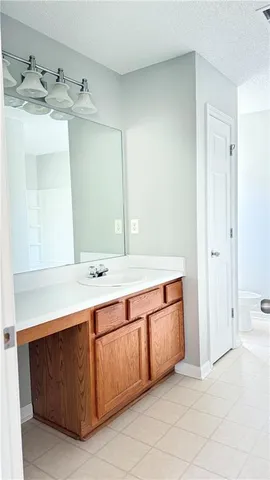 a view of a room with wooden floor and windows