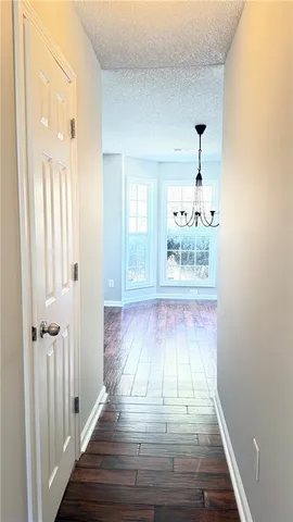 a view of an entryway with wooden floor