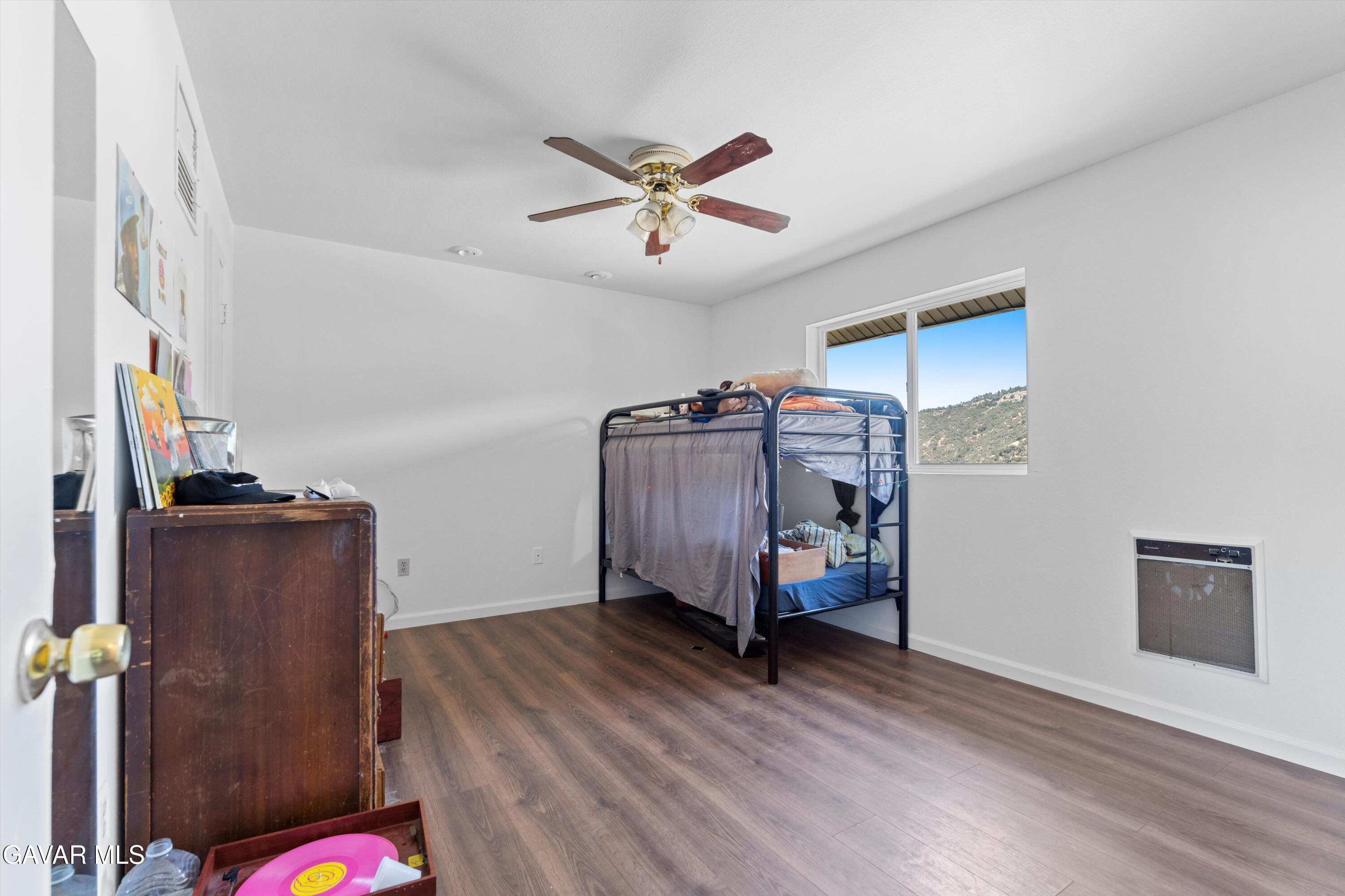 24750 Flatiron Court Tehachapi, CA 93561 - Photo 15 of 25 a view of a livingroom with furniture and ceiling fan