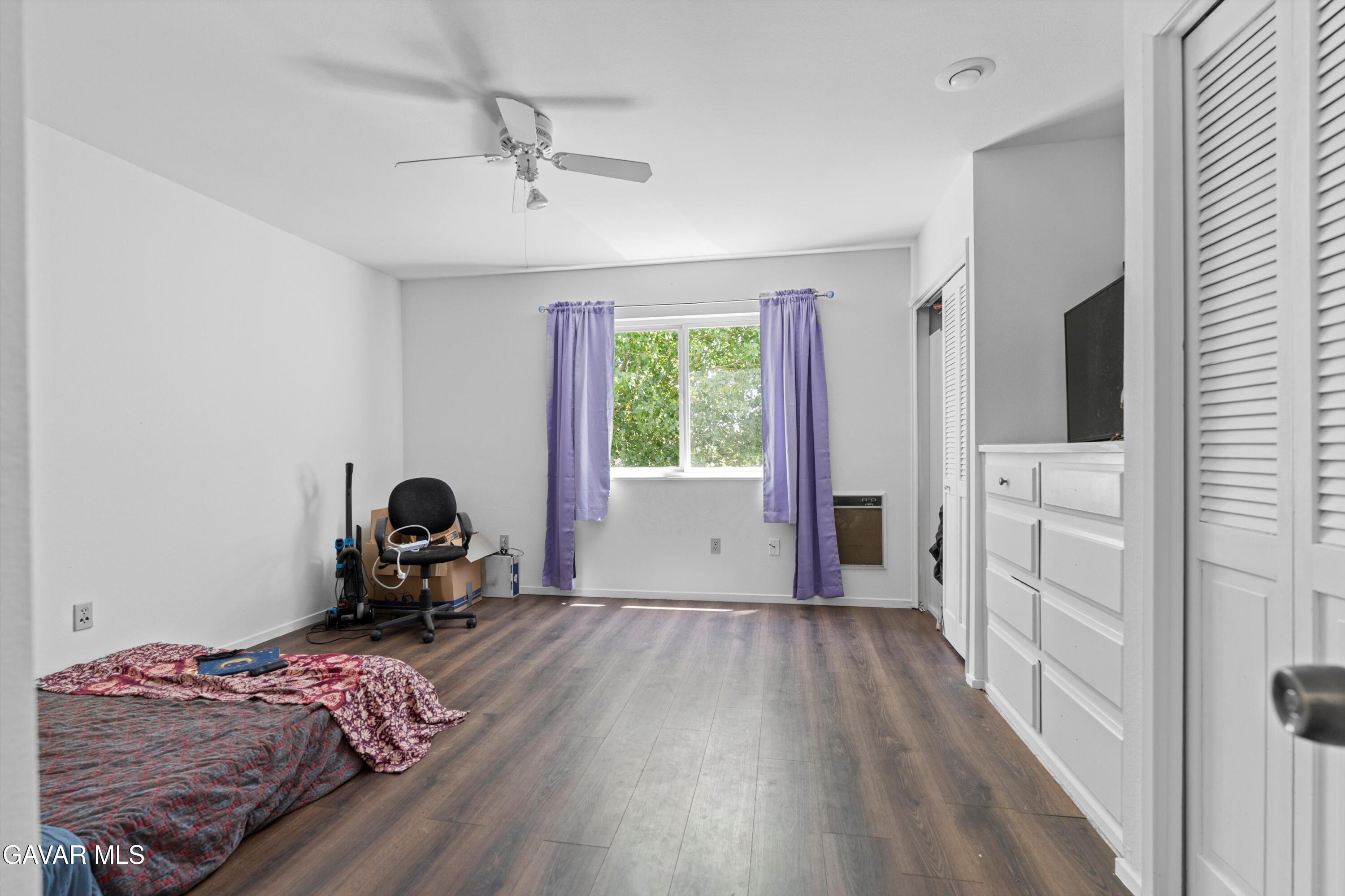 24750 Flatiron Court Tehachapi, CA 93561 - Photo 16 of 25 a bedroom with furniture and a window