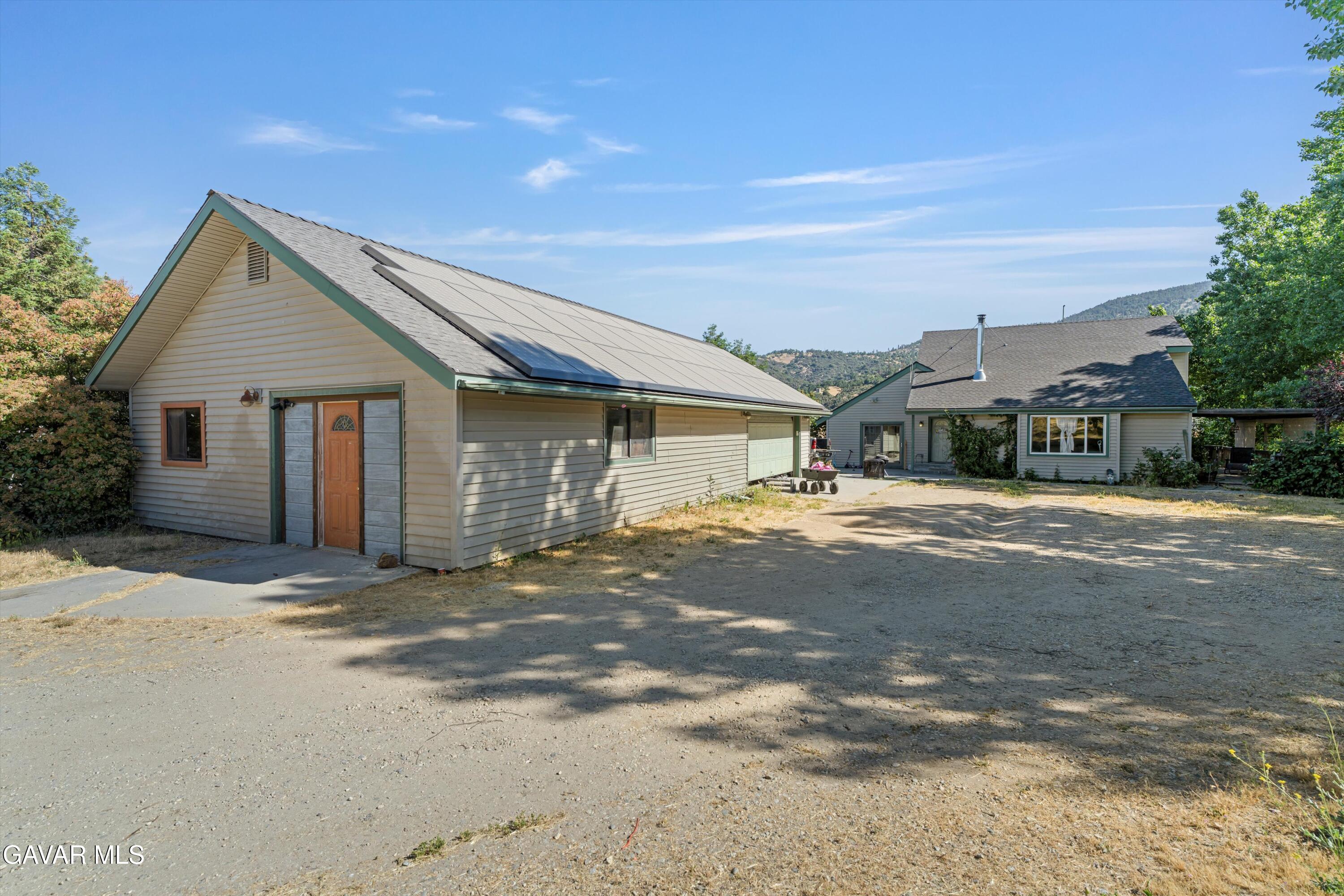 24750 Flatiron Court Tehachapi, CA 93561 - Photo 2 of 25 a house with trees in the background