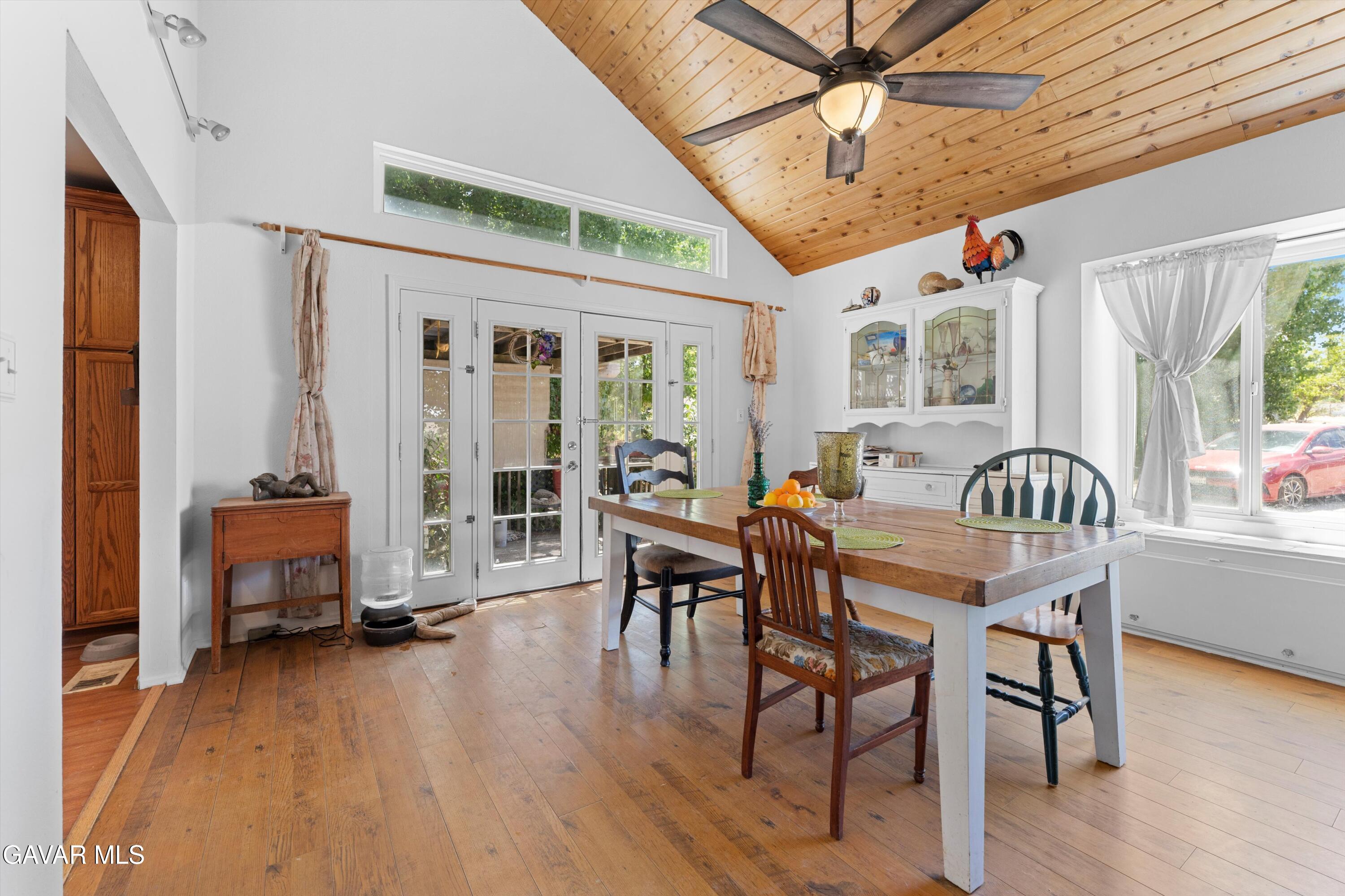 24750 Flatiron Court Tehachapi, CA 93561 - Photo 7 of 25 a view of a dining room with furniture window and wooden floor