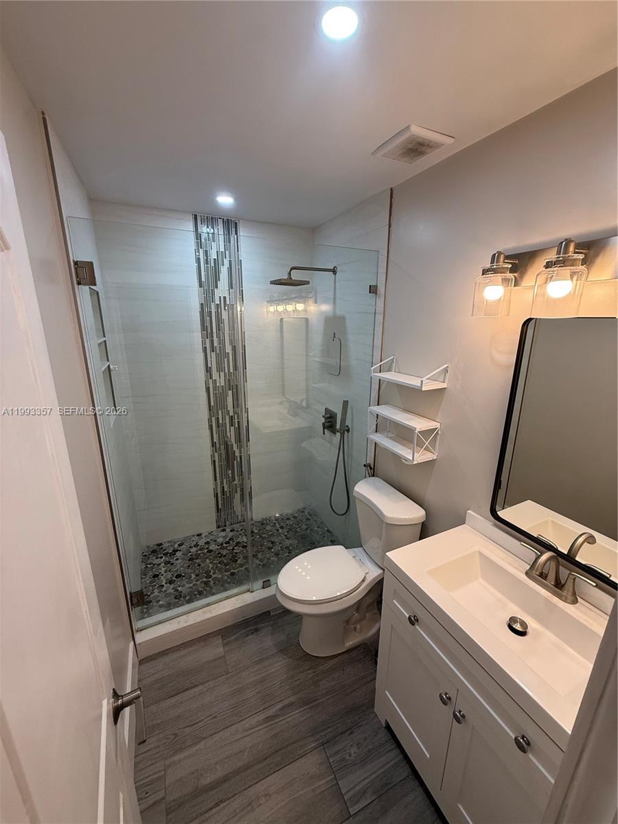 1050 West 37th Street Hialeah, FL 33012 - Photo 11 of 19 a bathroom with a sink toilet and shower