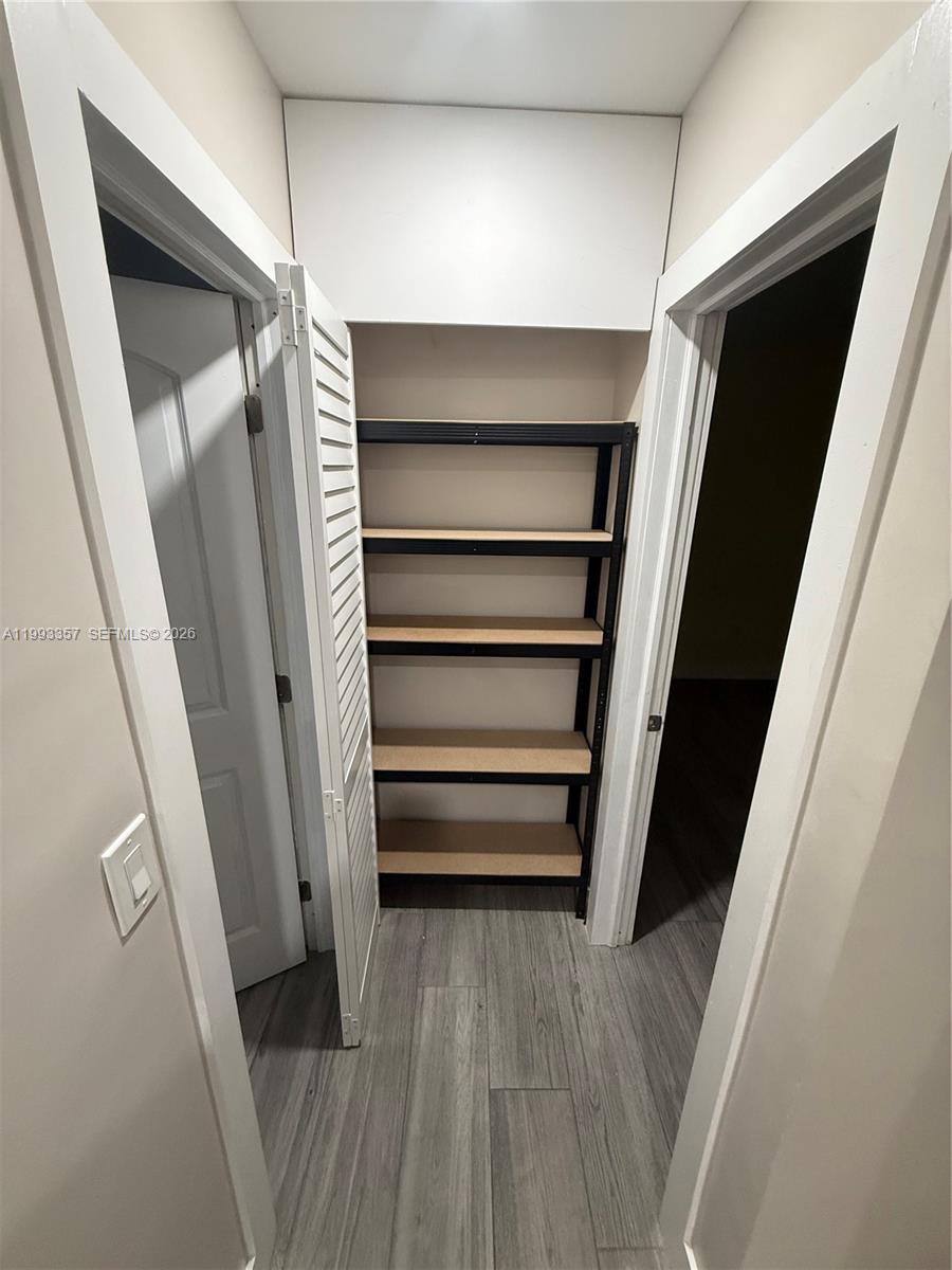 1050 West 37th Street Hialeah, FL 33012 - Photo 12 of 19 a view of walk in closet with empty racks
