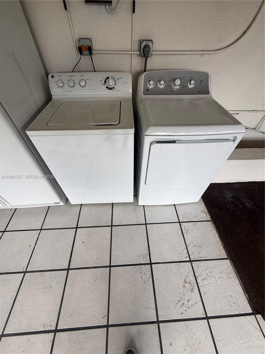 1050 West 37th Street Hialeah, FL 33012 - Photo 14 of 19 a utility room with dryer and washer
