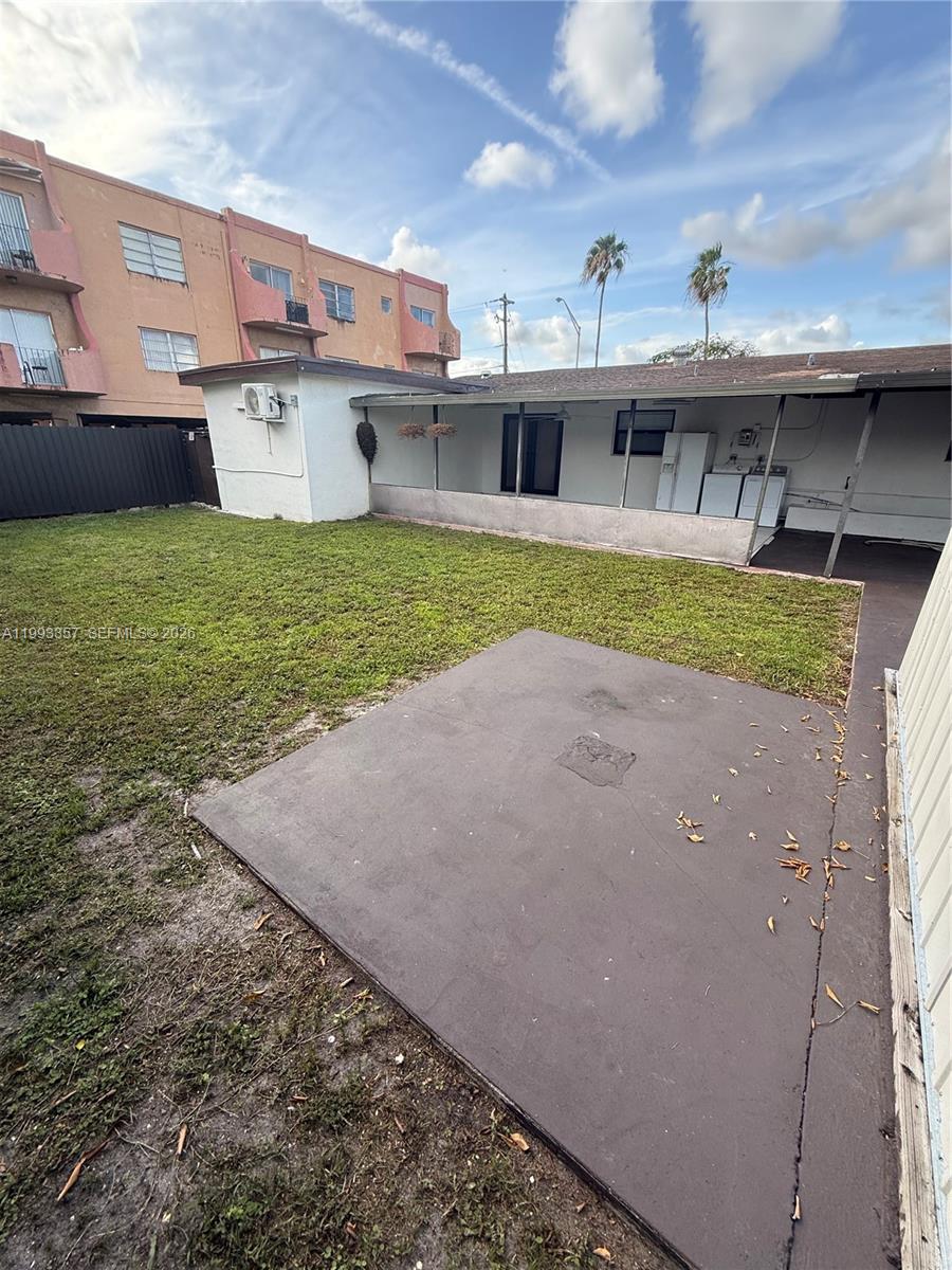 1050 West 37th Street Hialeah, FL 33012 - Photo 18 of 19 a view of a house with a yard