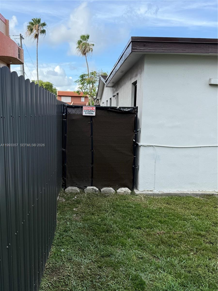 1050 West 37th Street Hialeah, FL 33012 - Photo 19 of 19 a backyard of a house with lots of green space