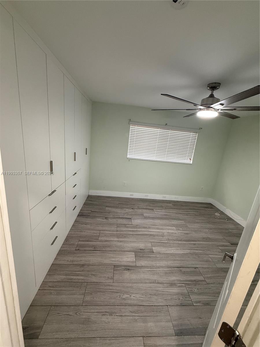 1050 West 37th Street Hialeah, FL 33012 - Photo 9 of 19 wooden floor in an empty room