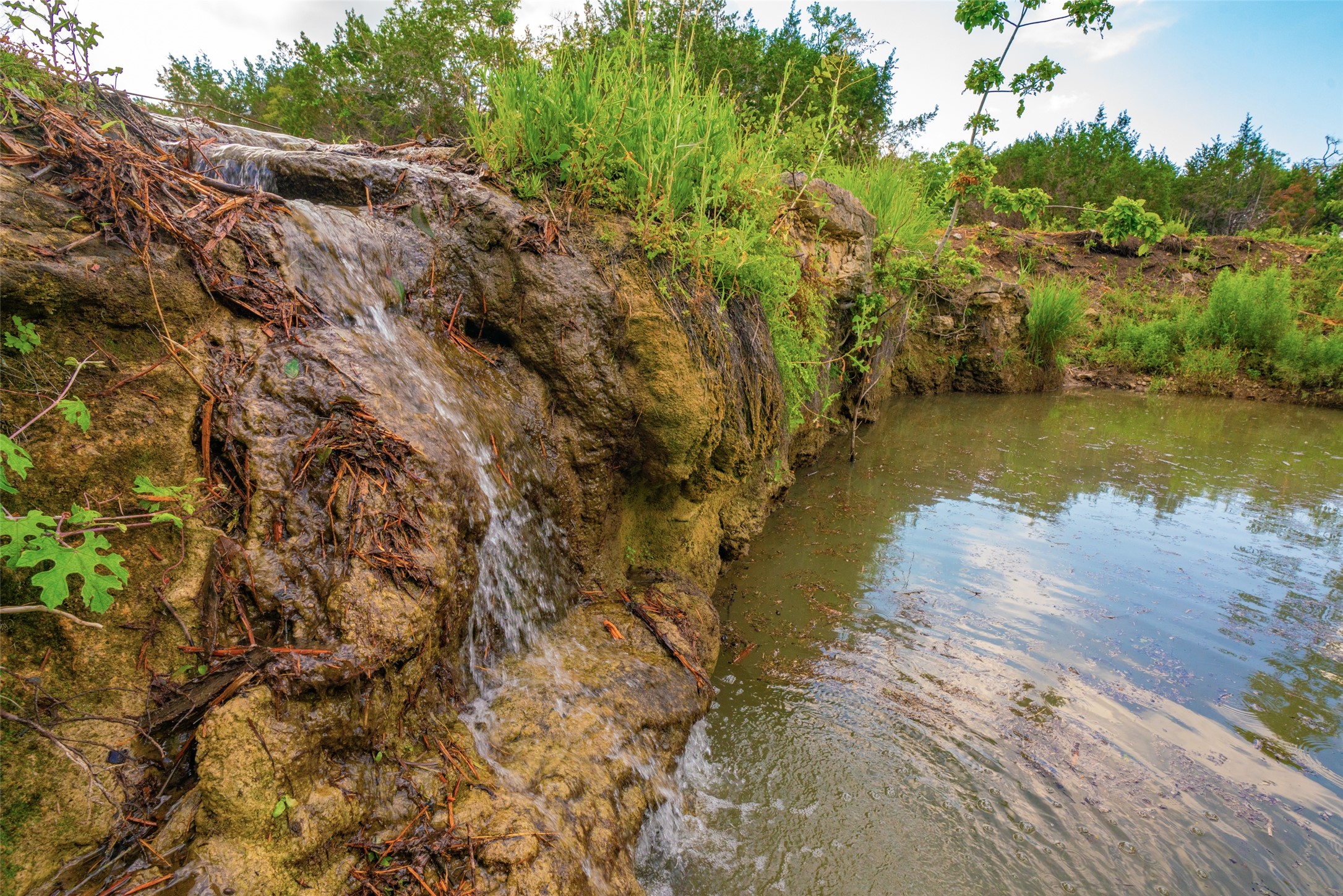 0 Spring Creek Ranch Wimberley, TX 78676 - Photo 3 of 29 a view of a lake with houses