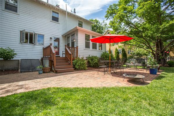 407 Weston Road Wellesley, MA 02482 - Photo 18 of 21 a view of a backyard with a table and chairs