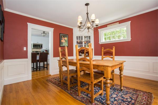 407 Weston Road Wellesley, MA 02482 - Photo 10 of 21 a view of a dining room with furniture a chandelier and wooden floor