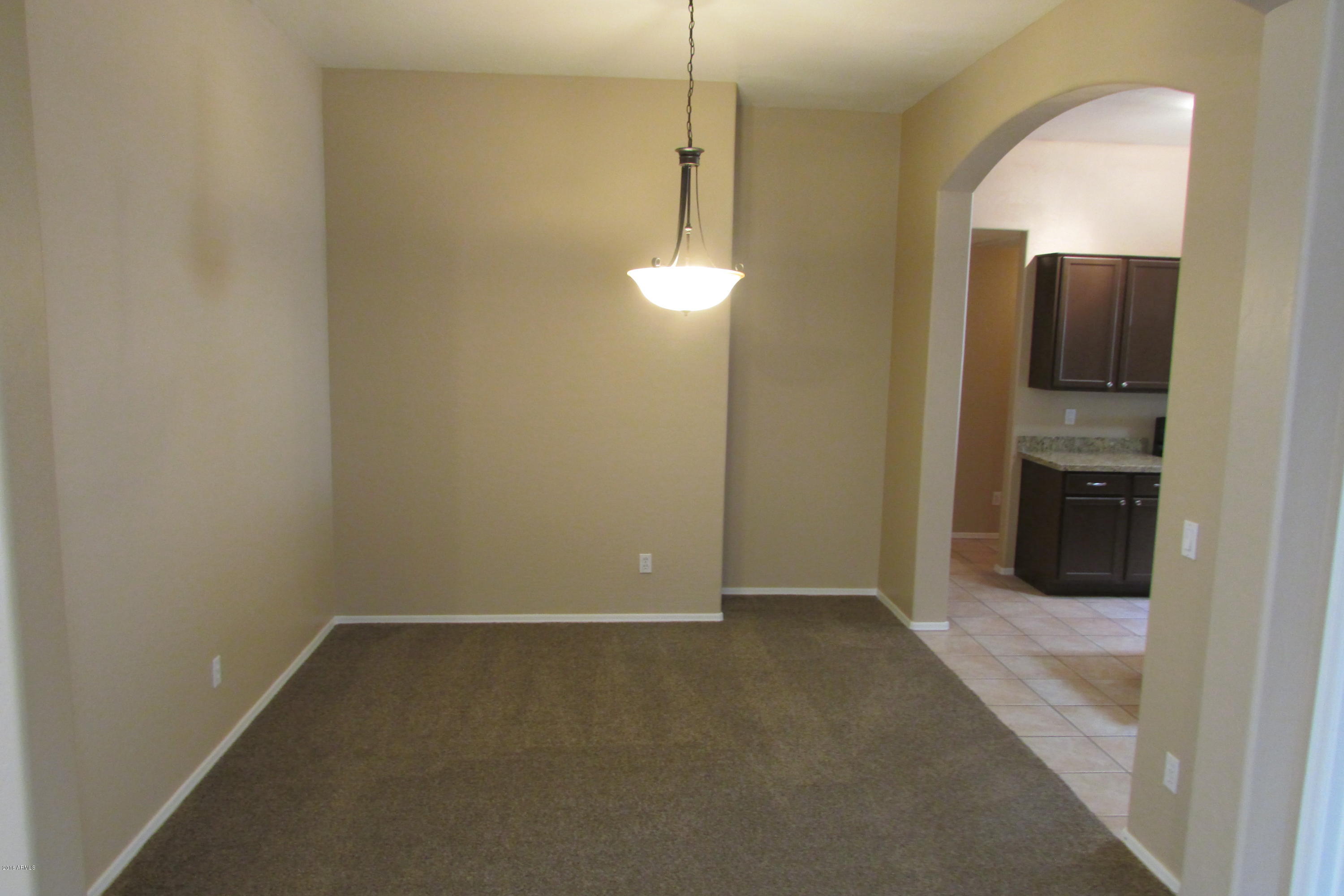 716 East Ranch Road Gilbert, AZ 85296 - Photo 5 of 22 a view of a room with a sink and a mirror