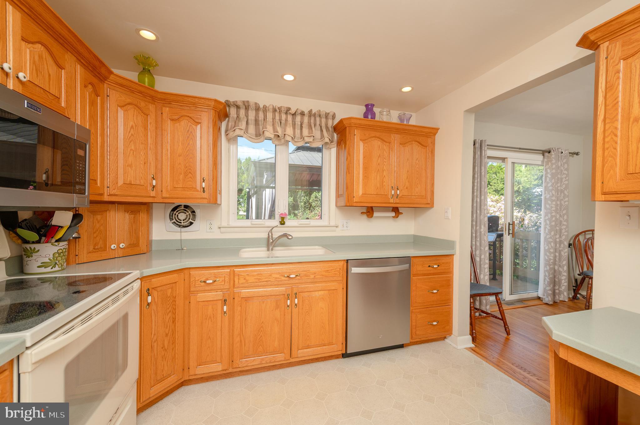 675 Gentry Drive Lancaster, PA 17603 - Photo 11 of 38 a large kitchen with stainless steel appliances granite countertop a sink and cabinets
