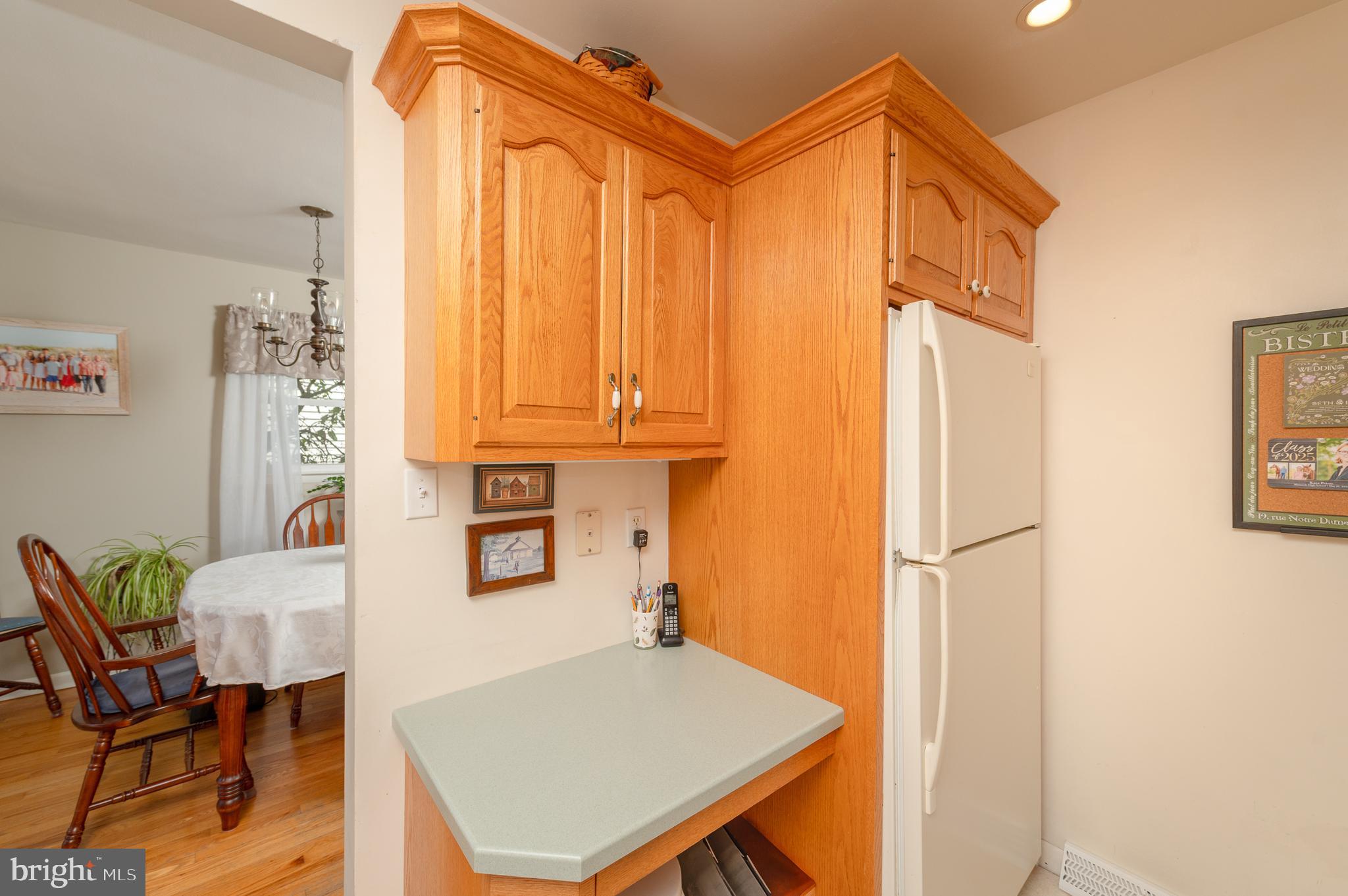 675 Gentry Drive Lancaster, PA 17603 - Photo 12 of 38 a living room with a table chairs and a refrigerator