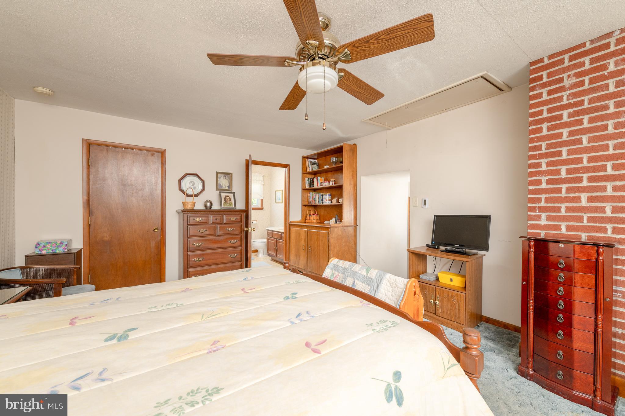 675 Gentry Drive Lancaster, PA 17603 - Photo 13 of 38 a bedroom with a bed and a flat screen tv