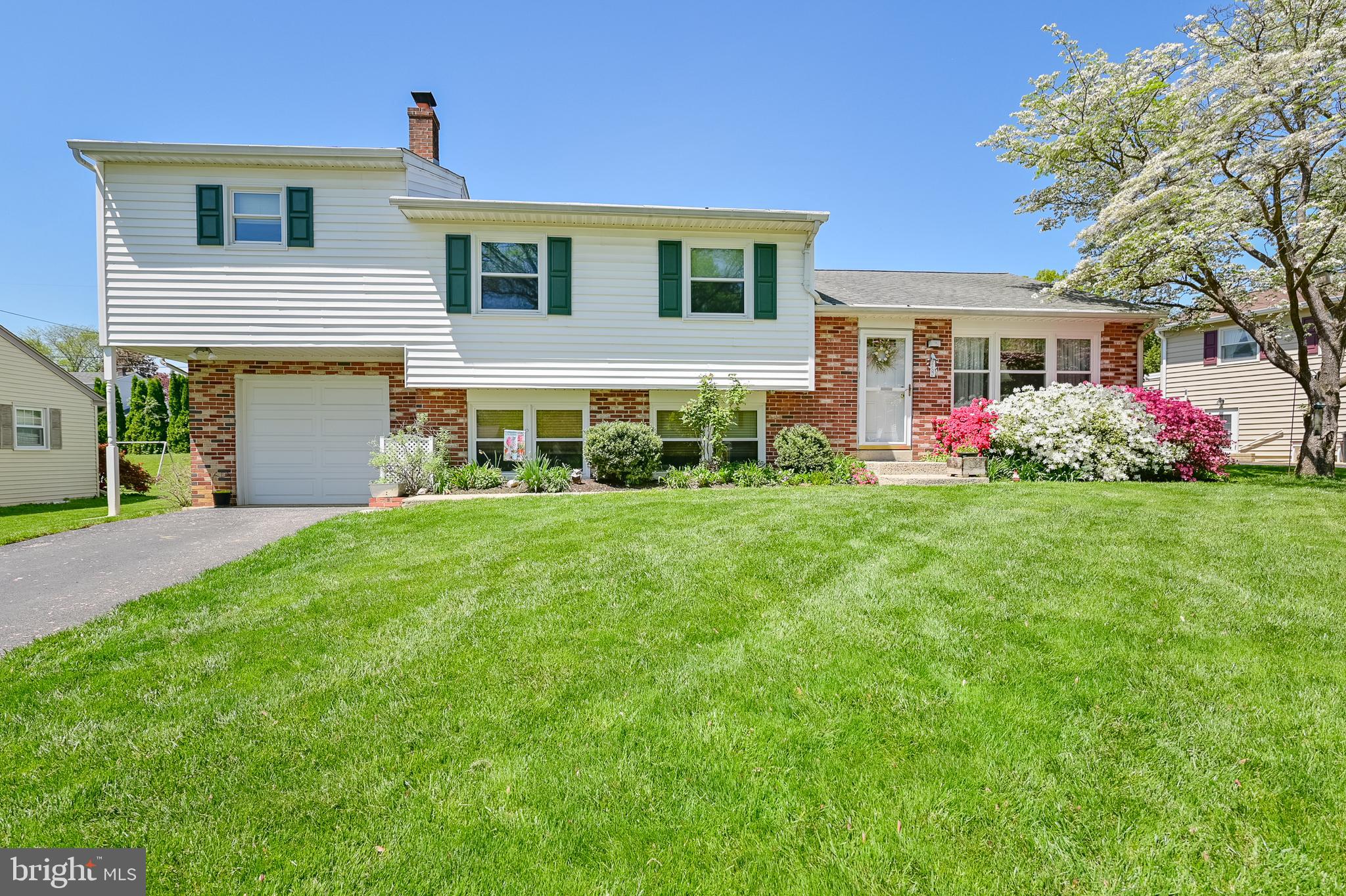 675 Gentry Drive Lancaster, PA 17603 - Photo 2 of 38 a front view of house with yard and green space