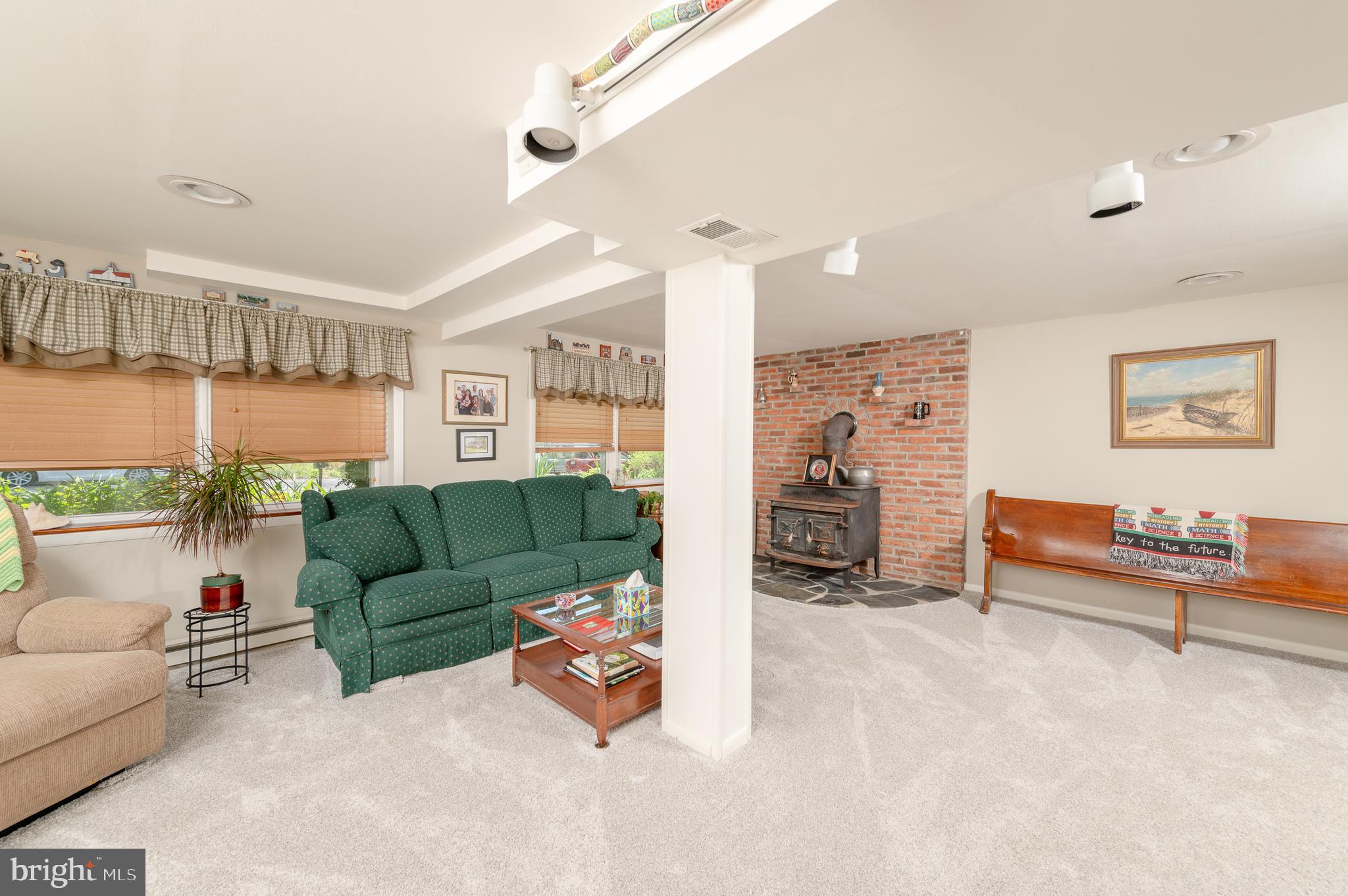 675 Gentry Drive Lancaster, PA 17603 - Photo 23 of 38 a living room with furniture and a lamp