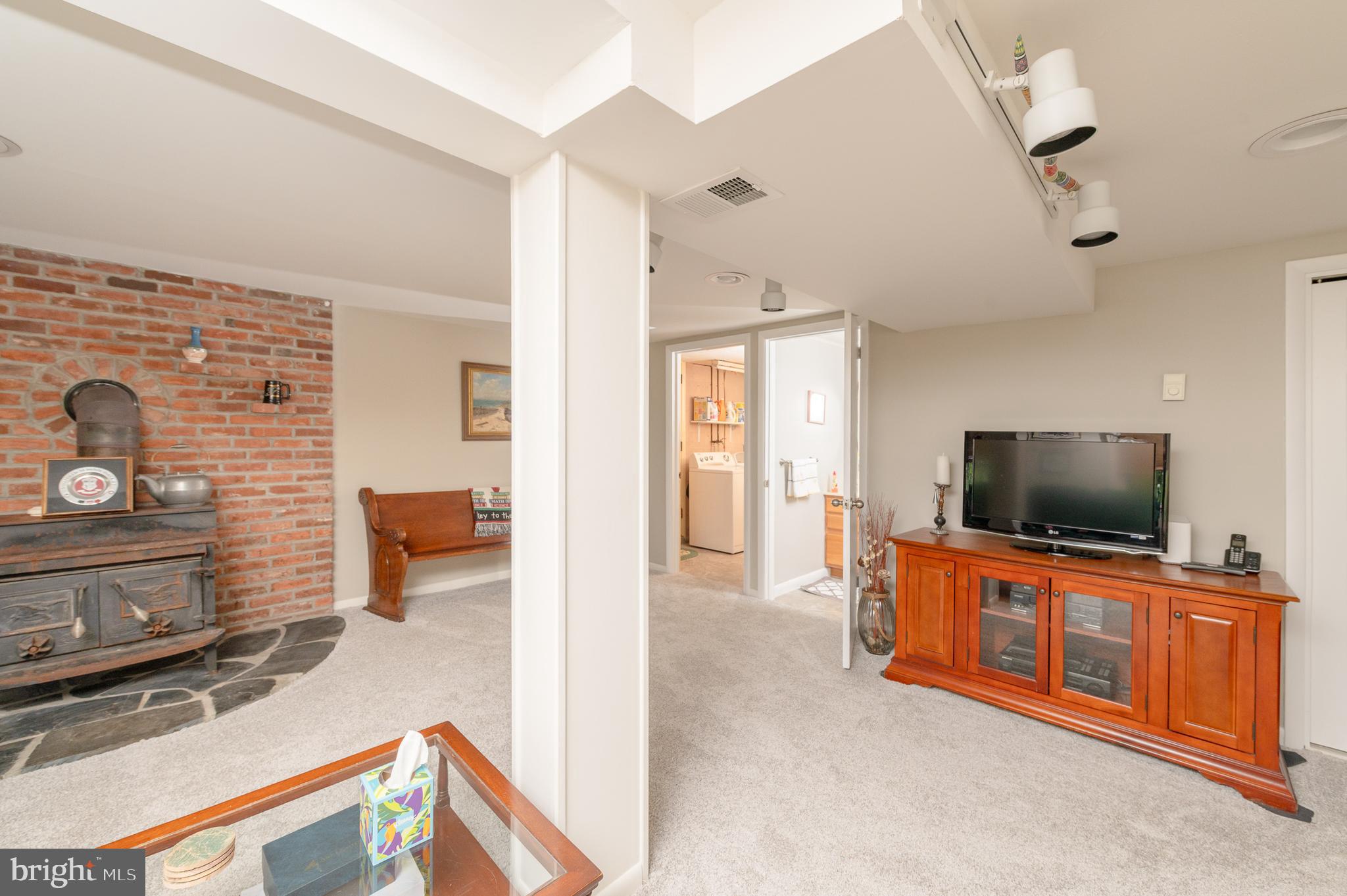 675 Gentry Drive Lancaster, PA 17603 - Photo 24 of 38 a living room with furniture and a flat screen tv